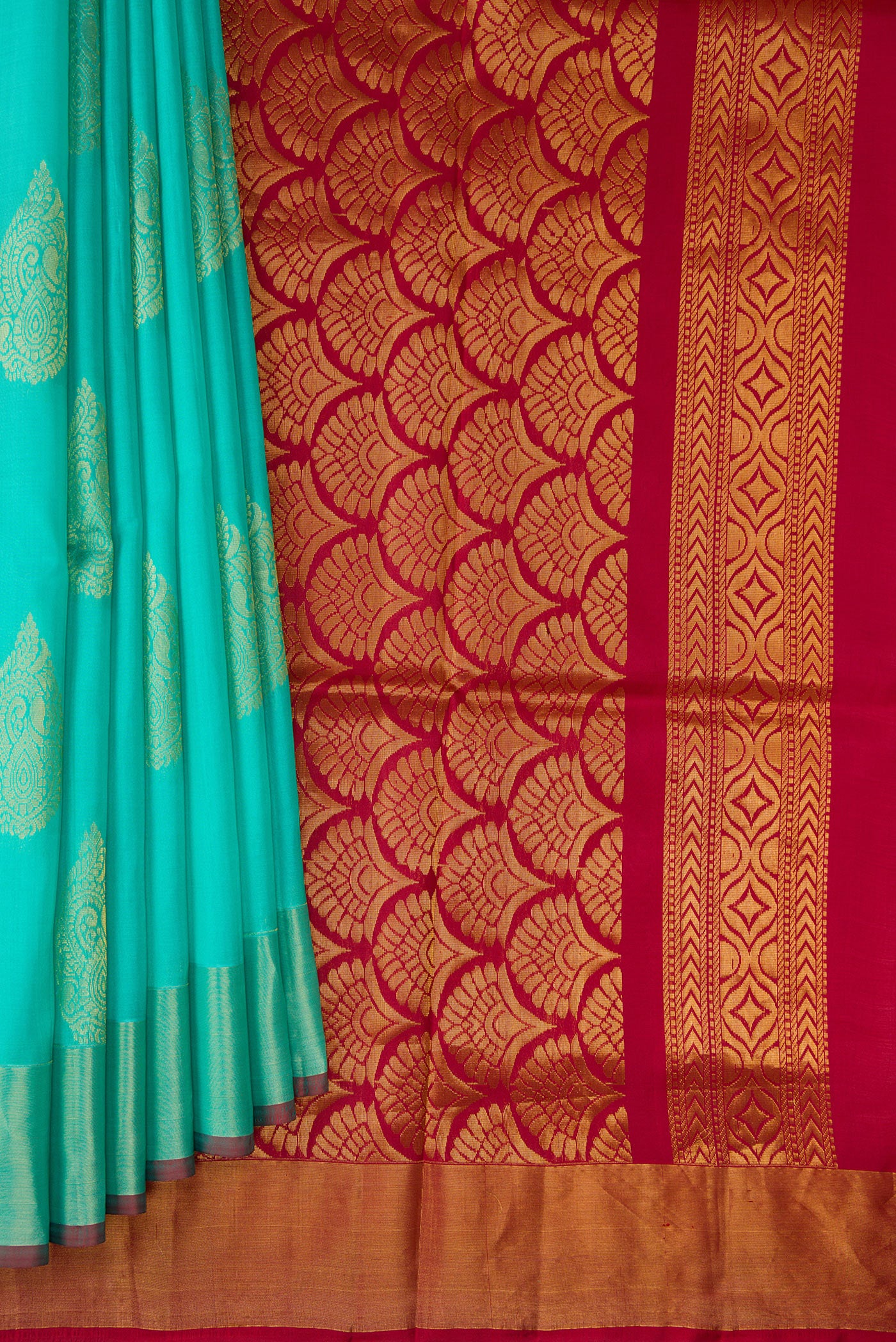 Pleats and pallu of Sky Blue Soft Silk Saree with Zari Butta on the body and Zari Border. 