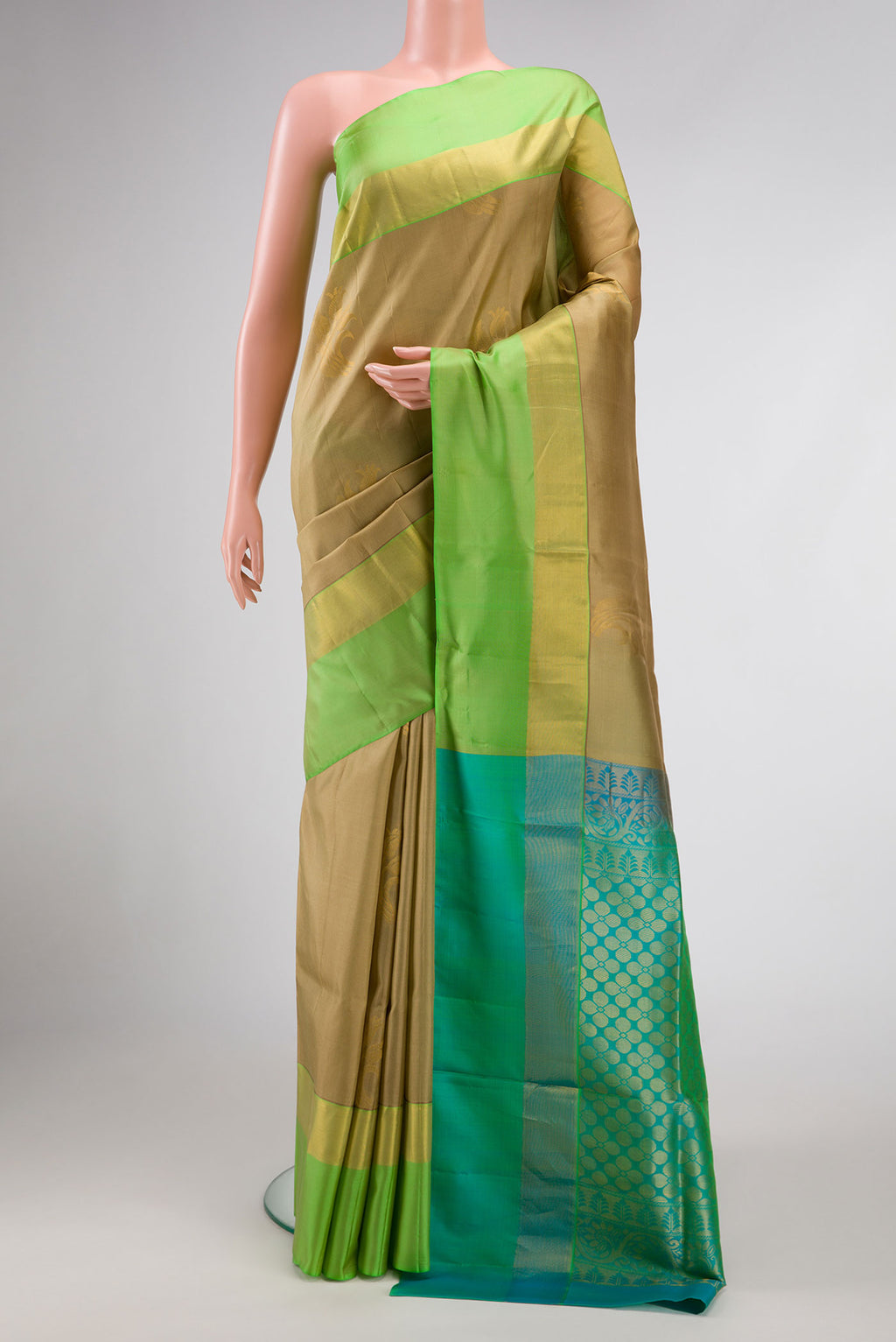 Gold Dual Tone Soft Silk Saree with Zari Butta on the body and Zari Border.  displayed on a mannequin