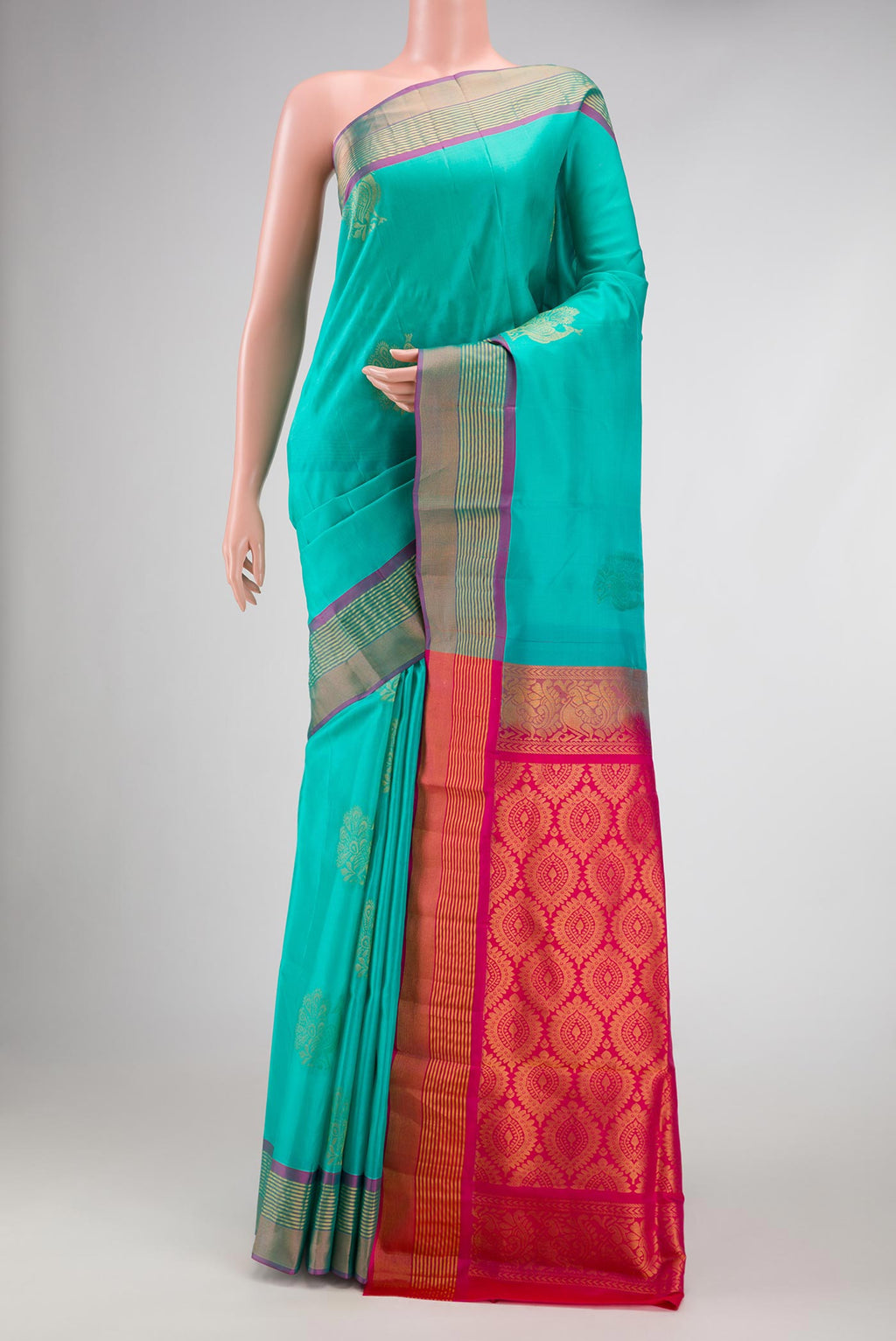 Sky Blue Dual Tone Soft Silk Saree with Zari Butta on the body and Zari Border.  displayed on a mannequin