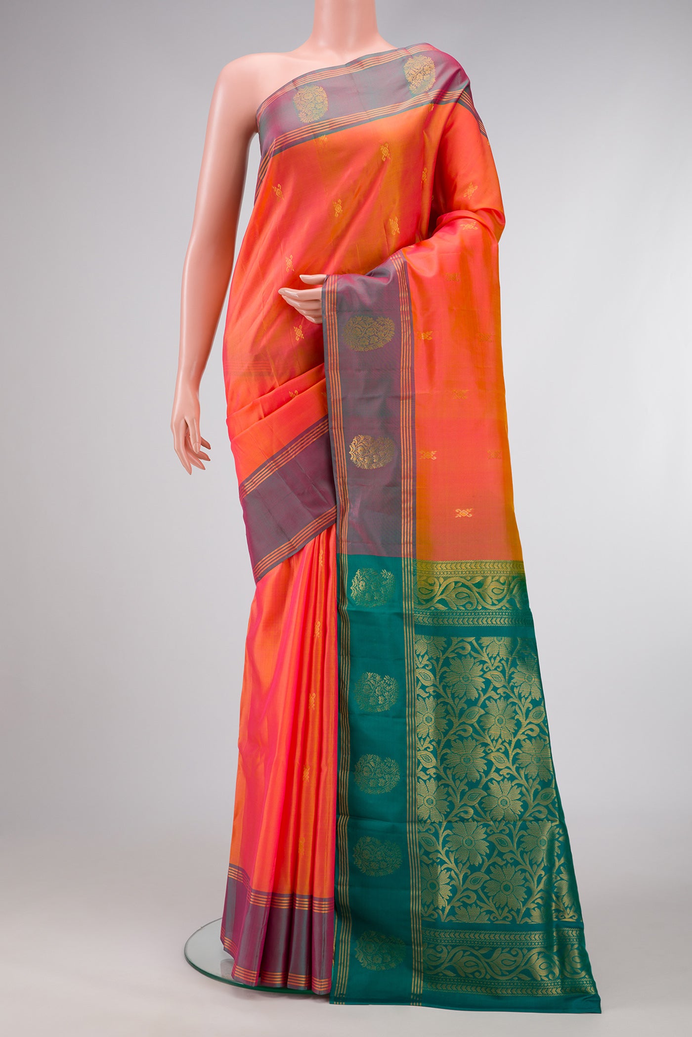 Coral Dual Tone Soft Silk Saree with Zari Butta on the body and Zari Border.  displayed on a mannequin