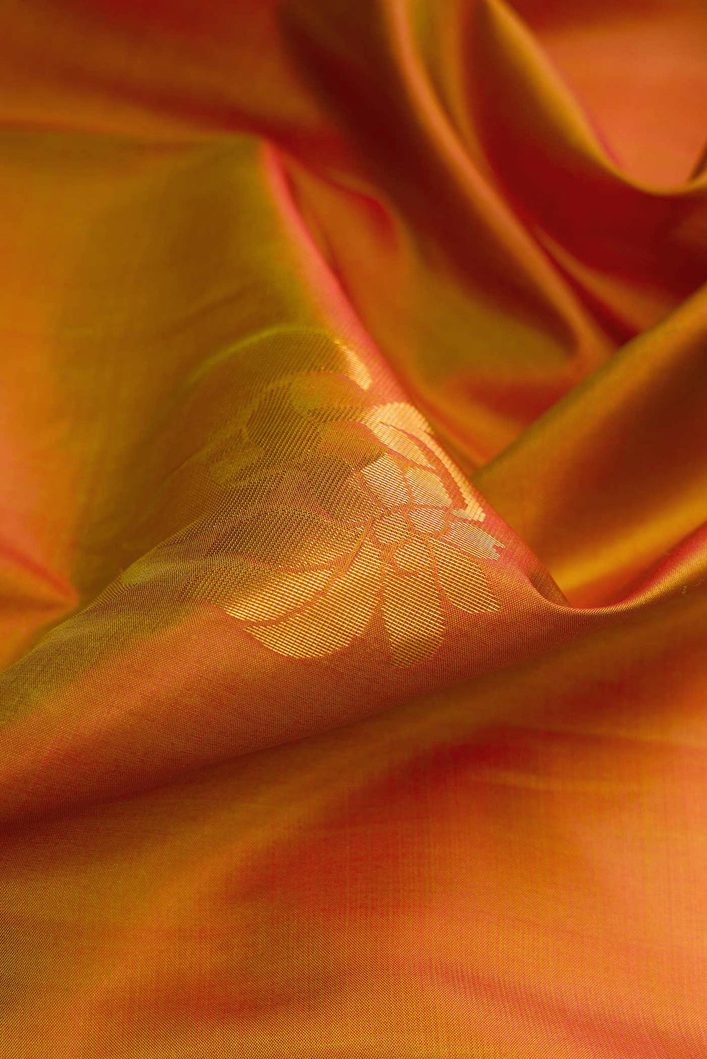 Close up of Mehandi Green Dual Tone Soft Silk Saree with Zari Butta on the body and Zari Border.  displaying folds