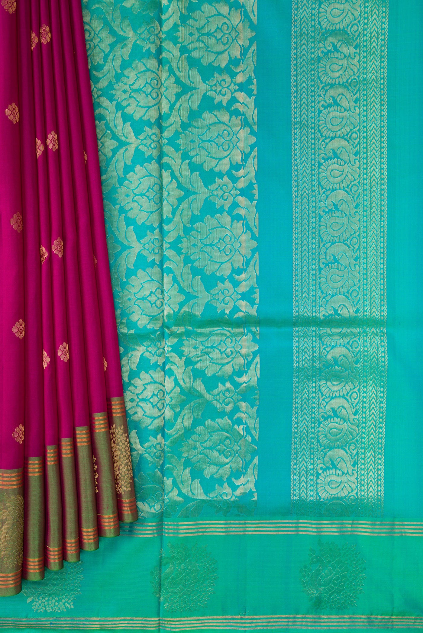 Pleats and pallu of Magenta Dual Tone Soft Silk Saree with Zari Butta on the body and Fancy Border. 