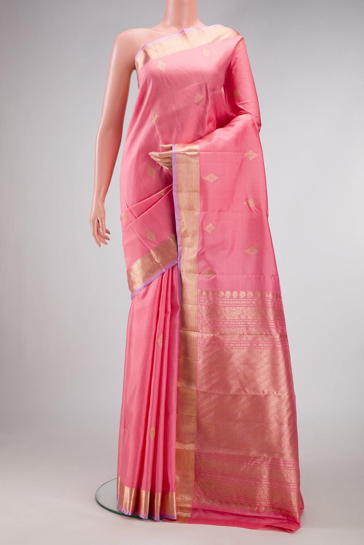 Pink Dual Tone Kanjivaram Silk Saree with Zari Butta on the body and Zari Border.  displayed on a mannequin
