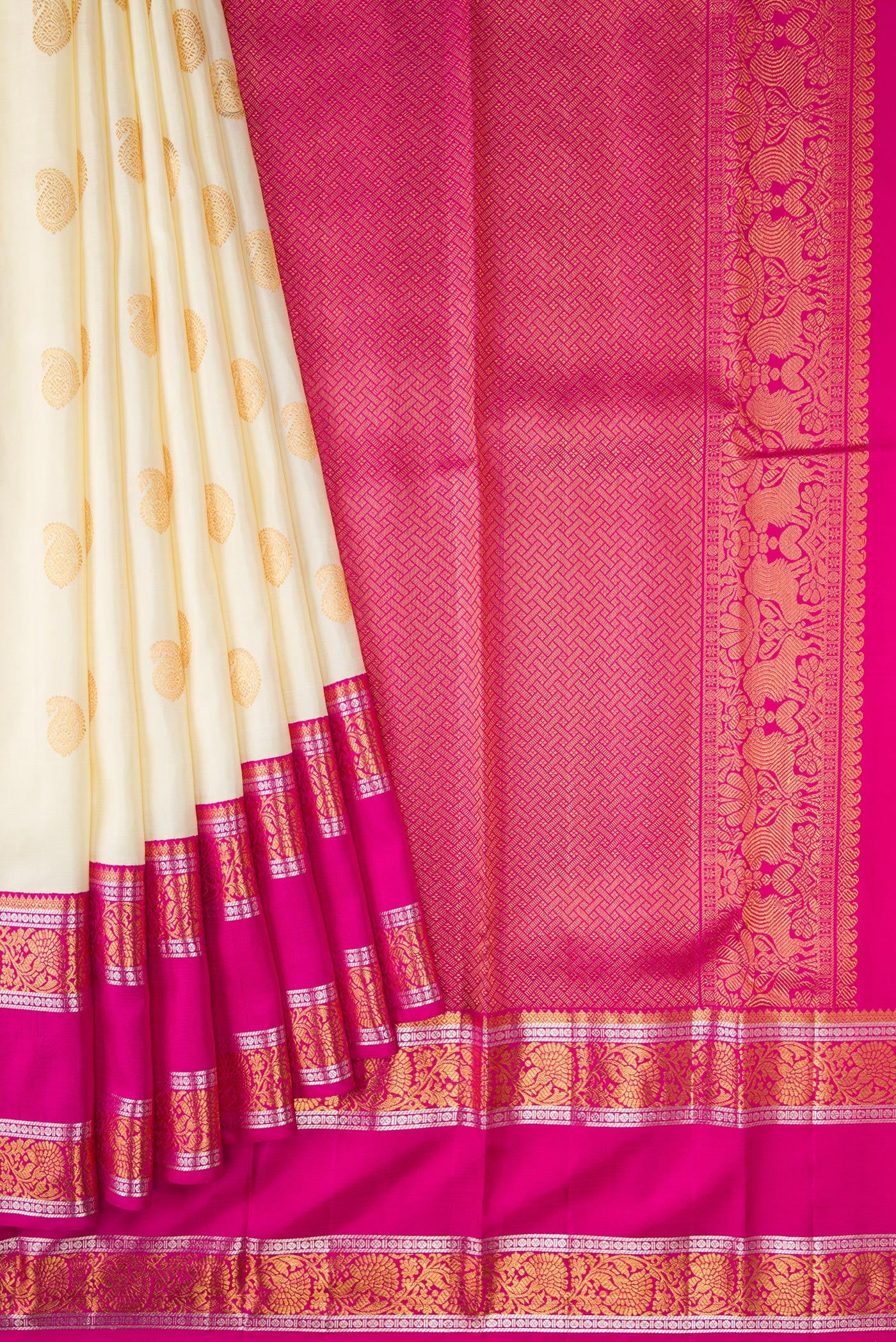 Pleats and pallu of Off White Dual Tone Kanchipuram Silk Saree with Zari Butta on the body and Zari Border. 