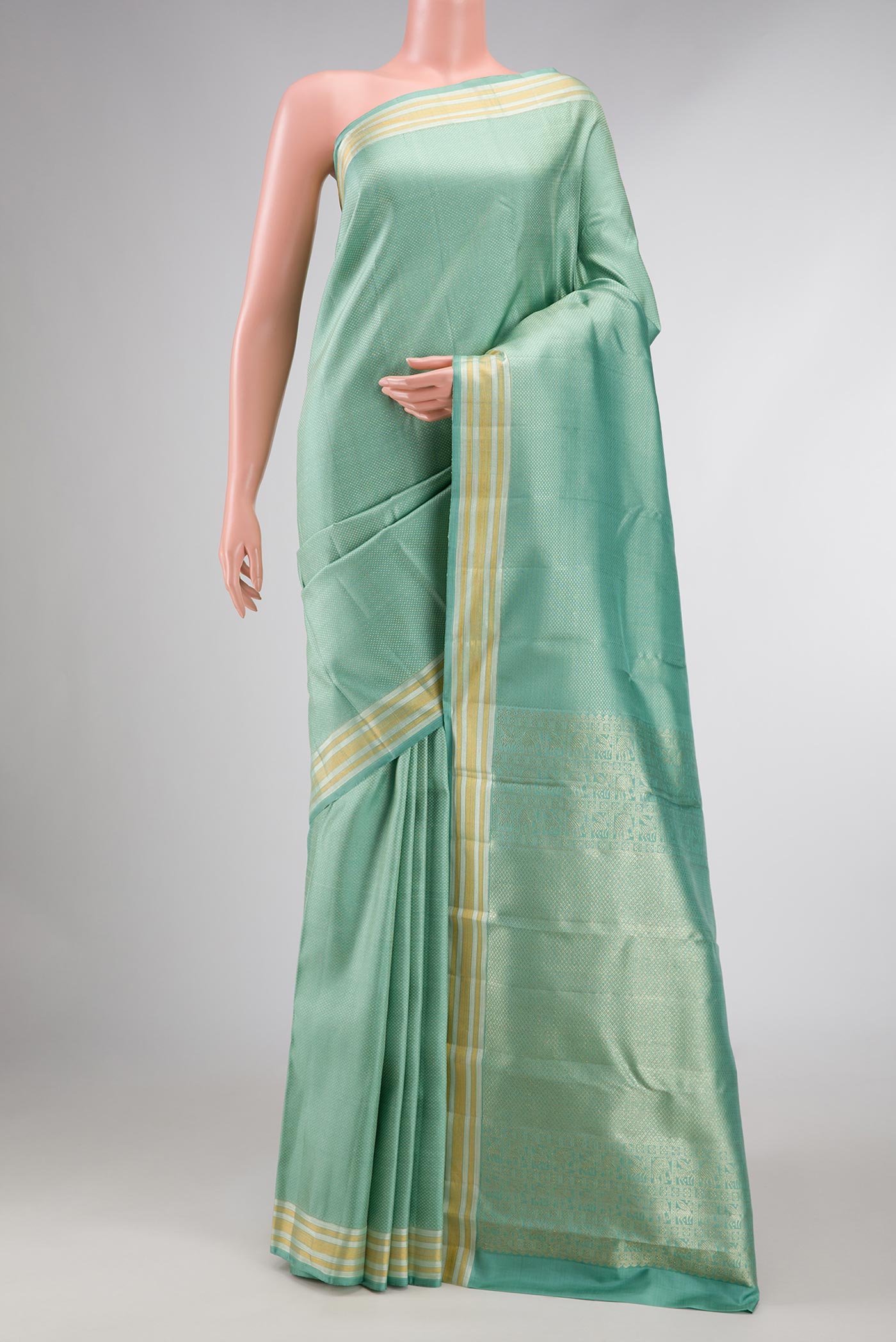 Light Blue Kanchipuram Silk Saree with Zari Brocade on the body and Zari Border displayed on a mannequin