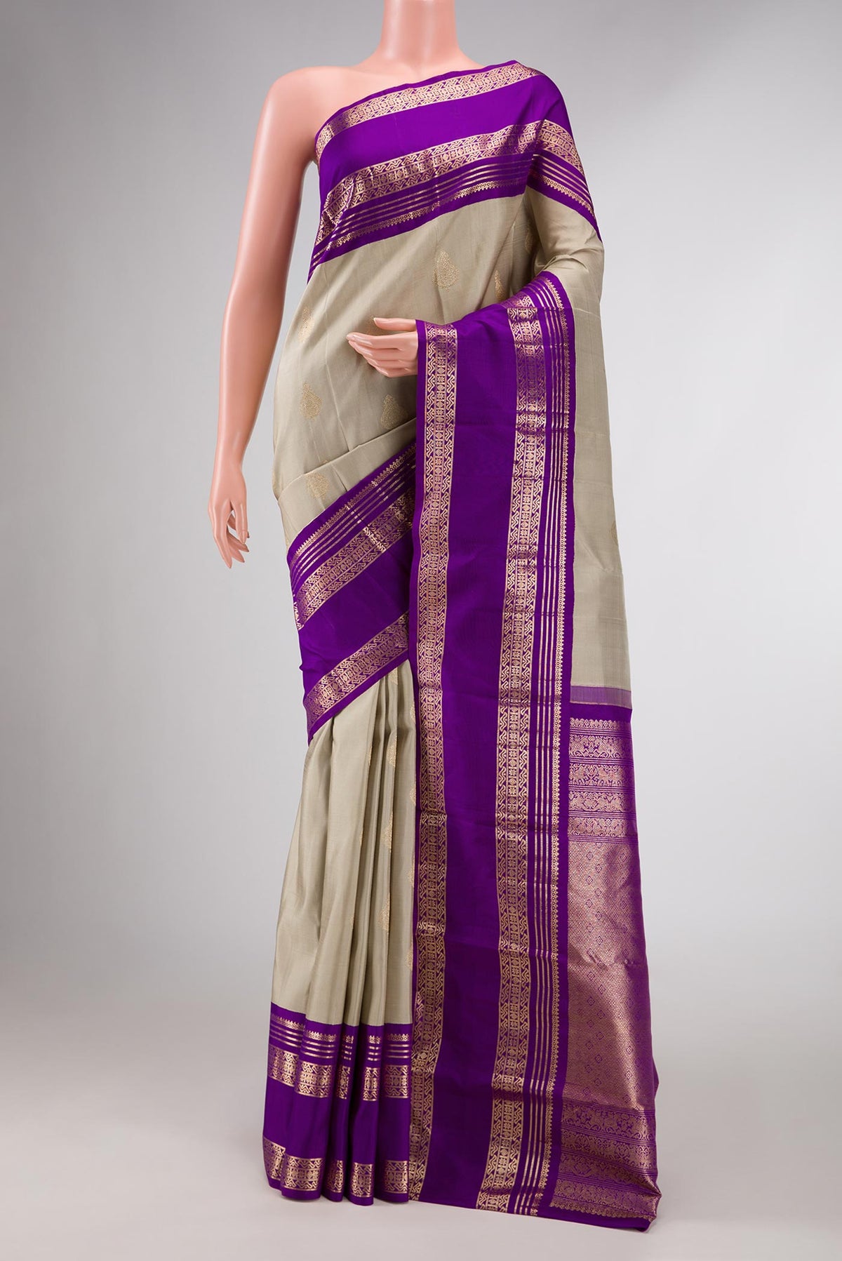 Grey Dual Tone Kanchipuram Silk Saree with Zari Butta on the body and Zari Border displayed on a mannequin