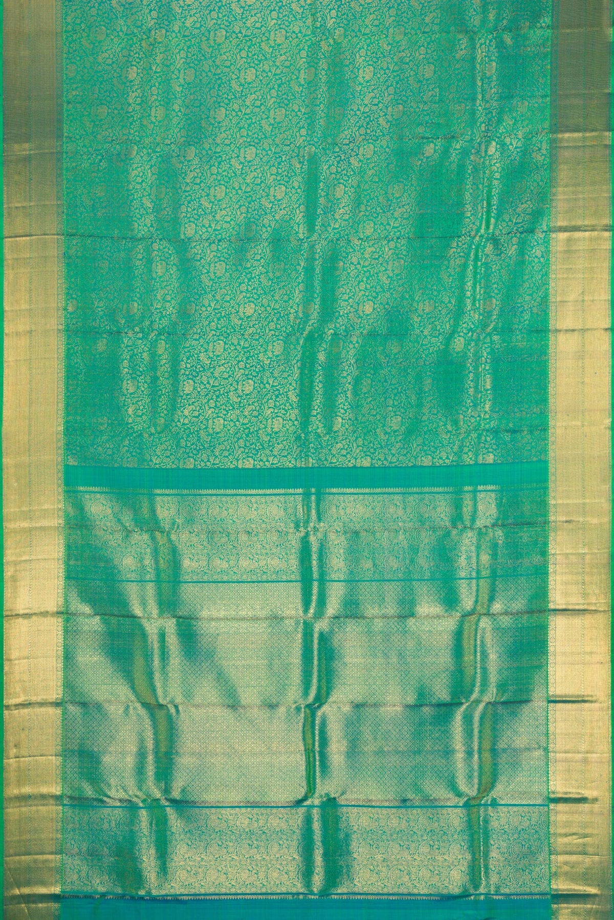 Flat view of Green Dual Tone Kanchipuram Silk Saree with Zari Brocade on the body and Zari Border. 