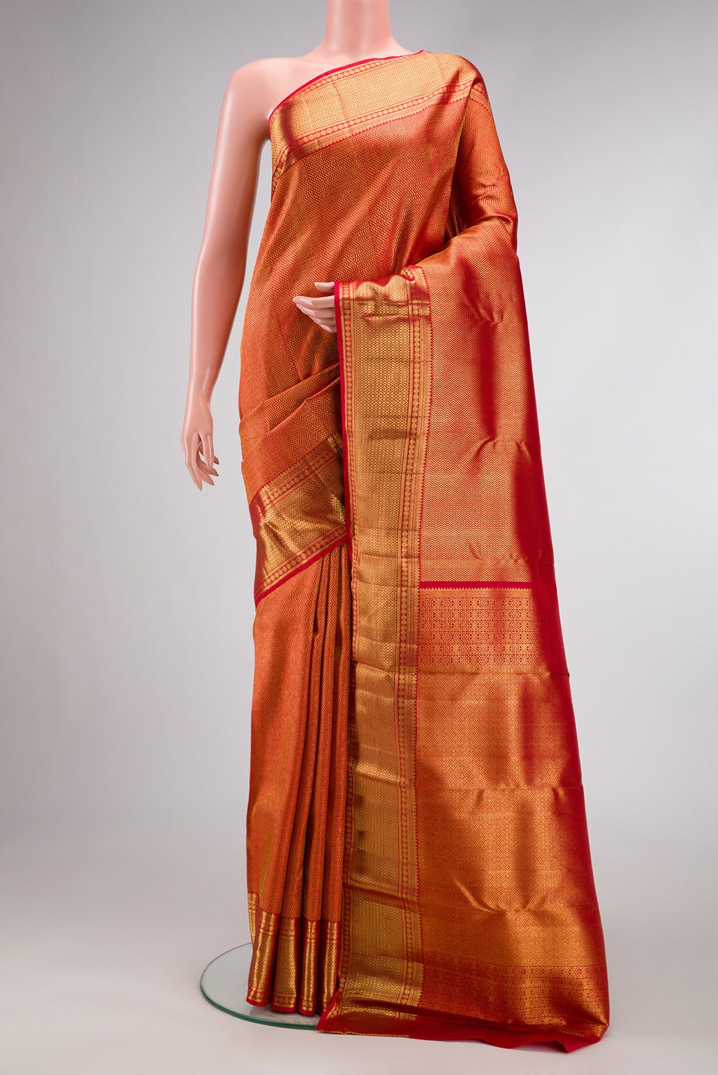 Dark Pink Dual Tone Kanchipuram Silk Saree with Zari Brocade on the body and Zari Border.  displayed on a mannequin