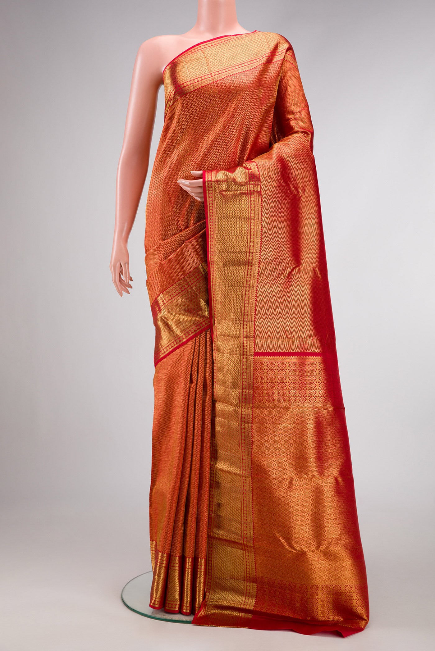 Dark Pink Dual Tone Kanchipuram Silk Saree with Zari Brocade on the body and Zari Border.  displayed on a mannequin