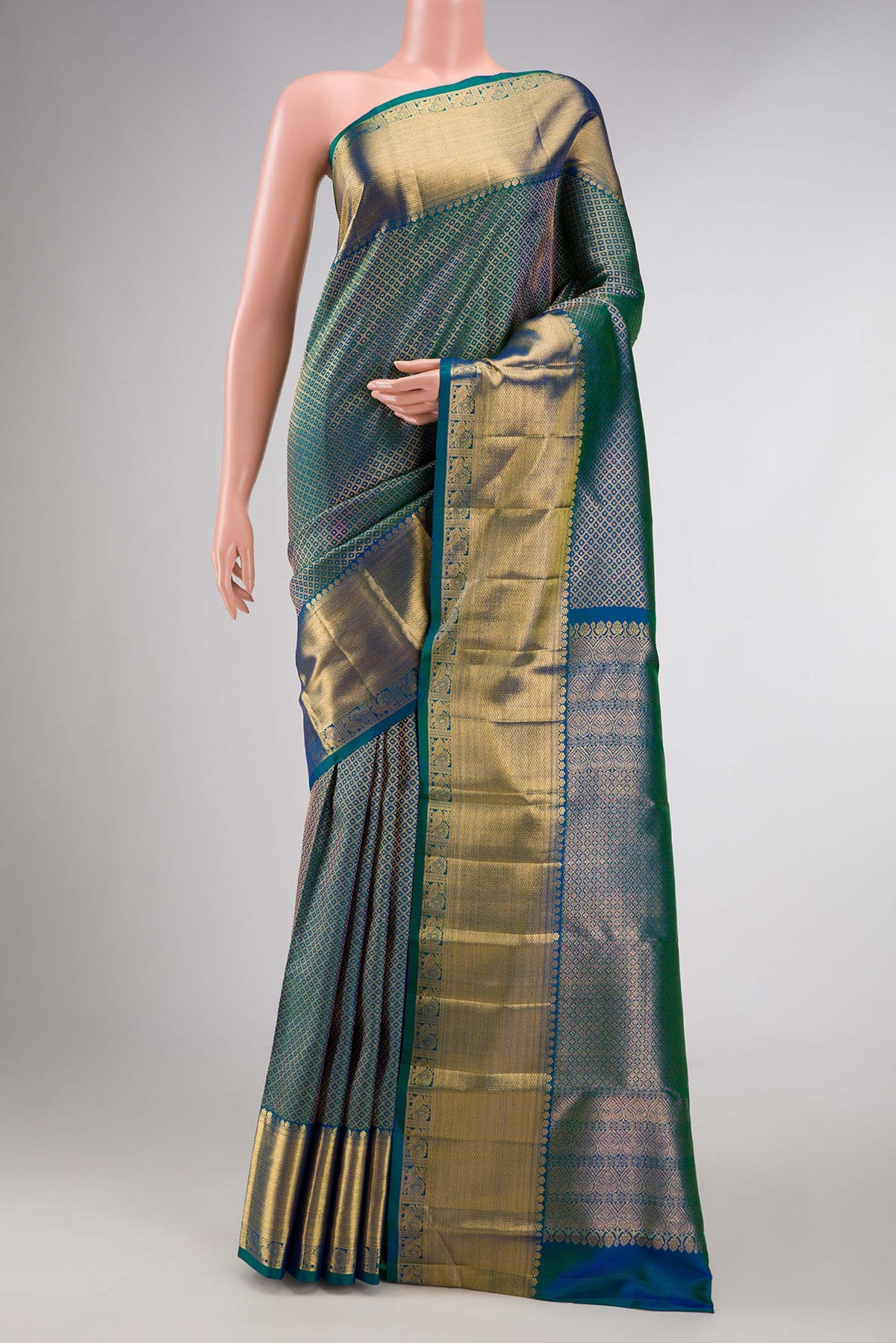 Peacock Blue Dual Tone Kanchipuram Silk Saree with Zari Brocade on the body and Zari Border displayed on a mannequin