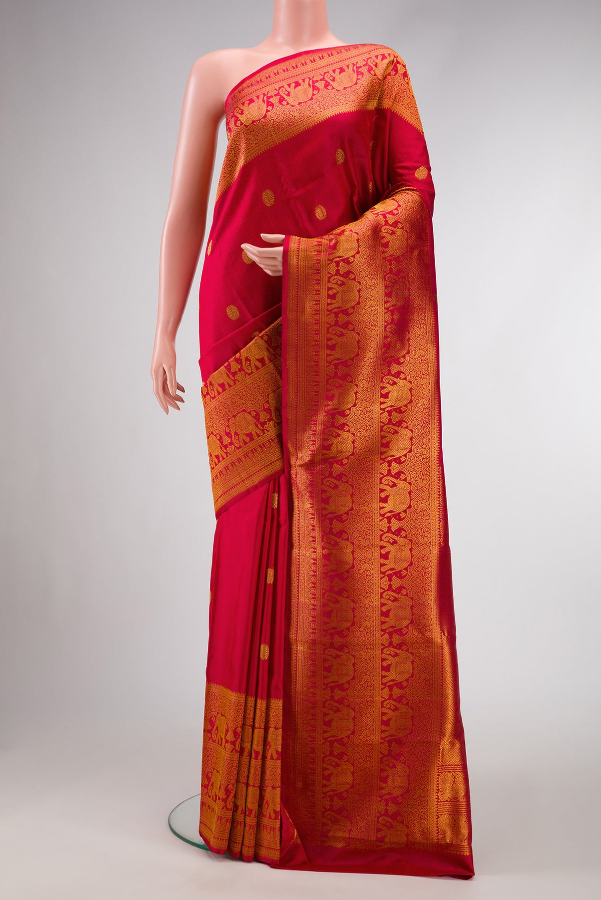 Red Dual Tone Kanchipuram Silk Saree with Zari Butta on the body and Zari Border.  displayed on a mannequin
