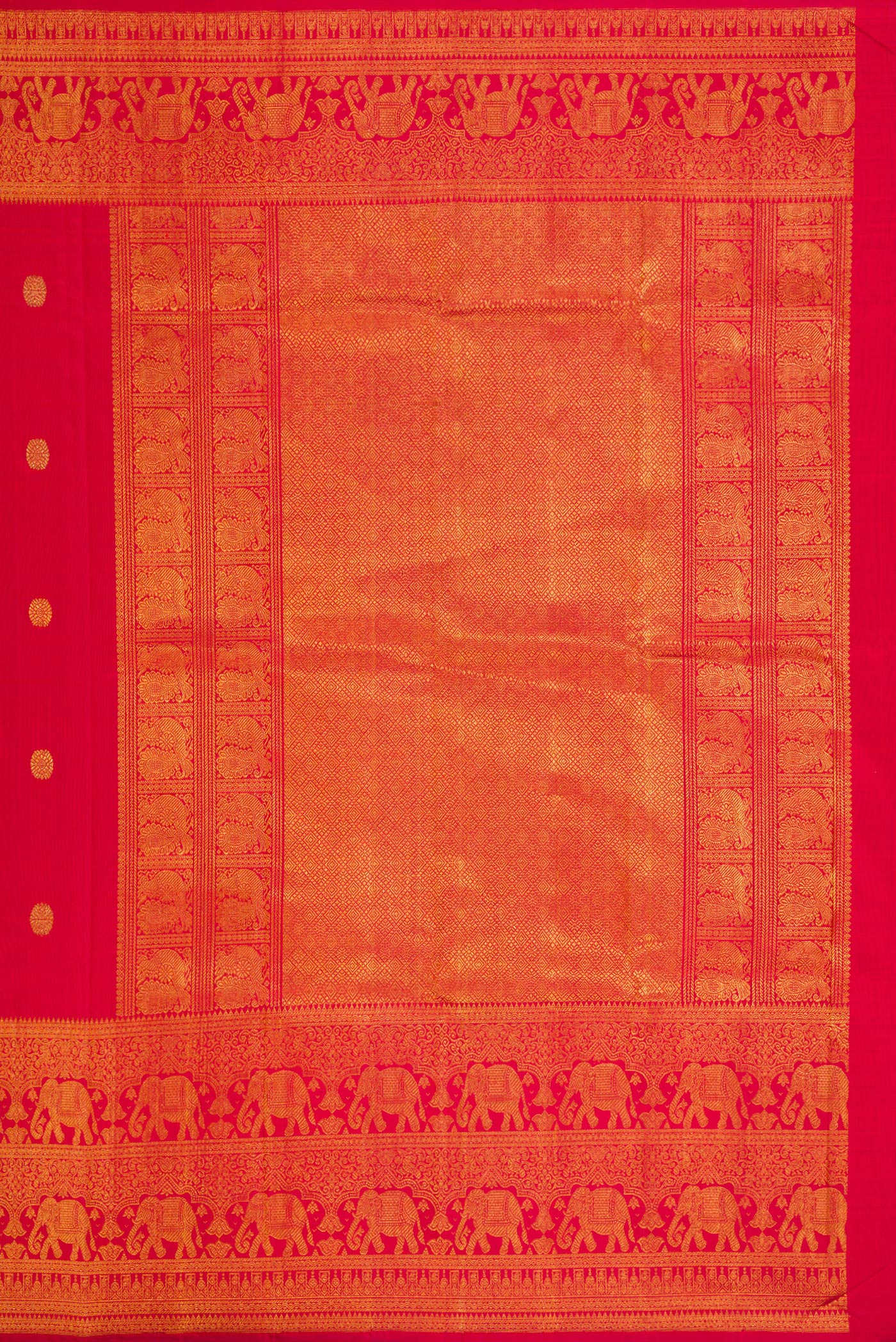 Close up image of the pallu of Red Dual Tone Kanchipuram Silk Saree with Zari Butta on the body and Zari Border. 