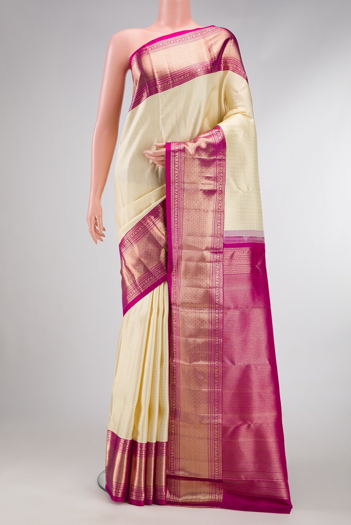 Off White Dual Tone Kanchipuram Silk Saree with Zari Brocade on the body and Zari Border.  displayed on a mannequin