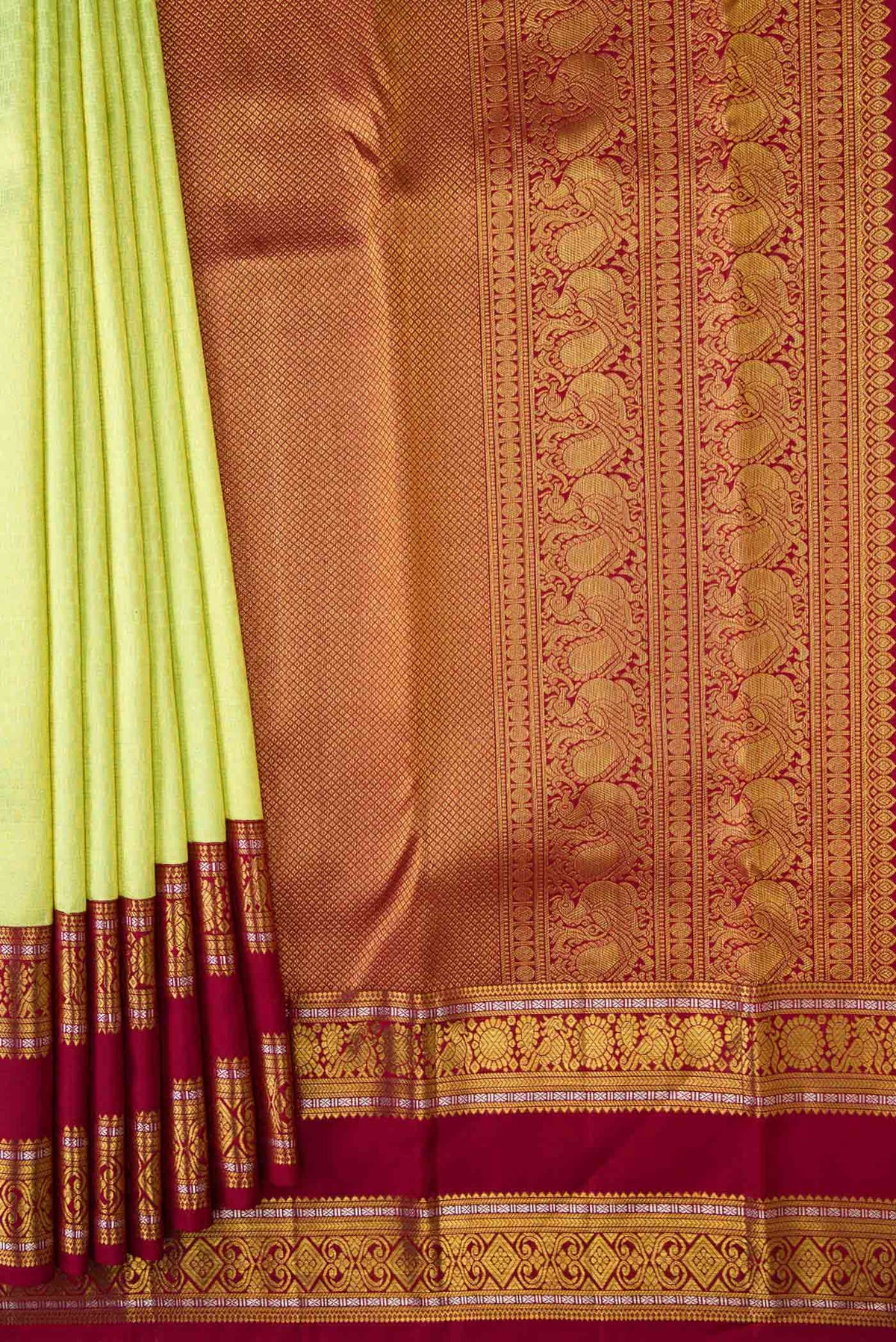 Pleats and pallu of Green Kanchipuram Silk Saree with Zari Brocade on the body and Zari Border