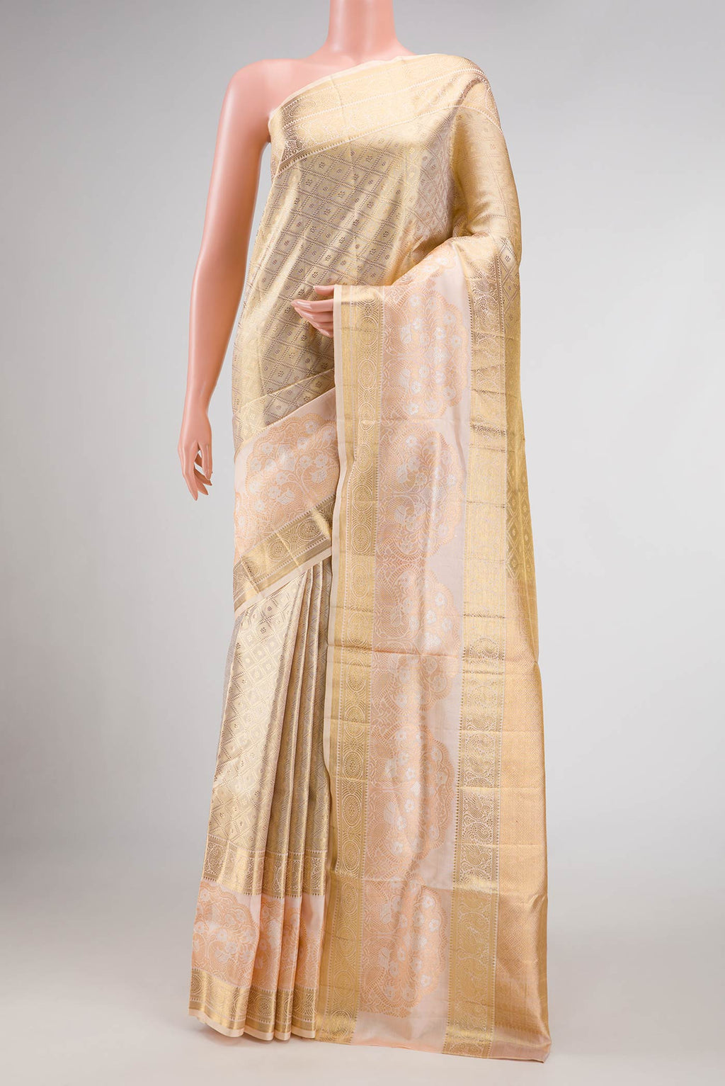 Gold Dual Tone Kanjivaram Tissue Silk Saree with Zari Brocade on the body and Fancy Border.  displayed on a mannequin