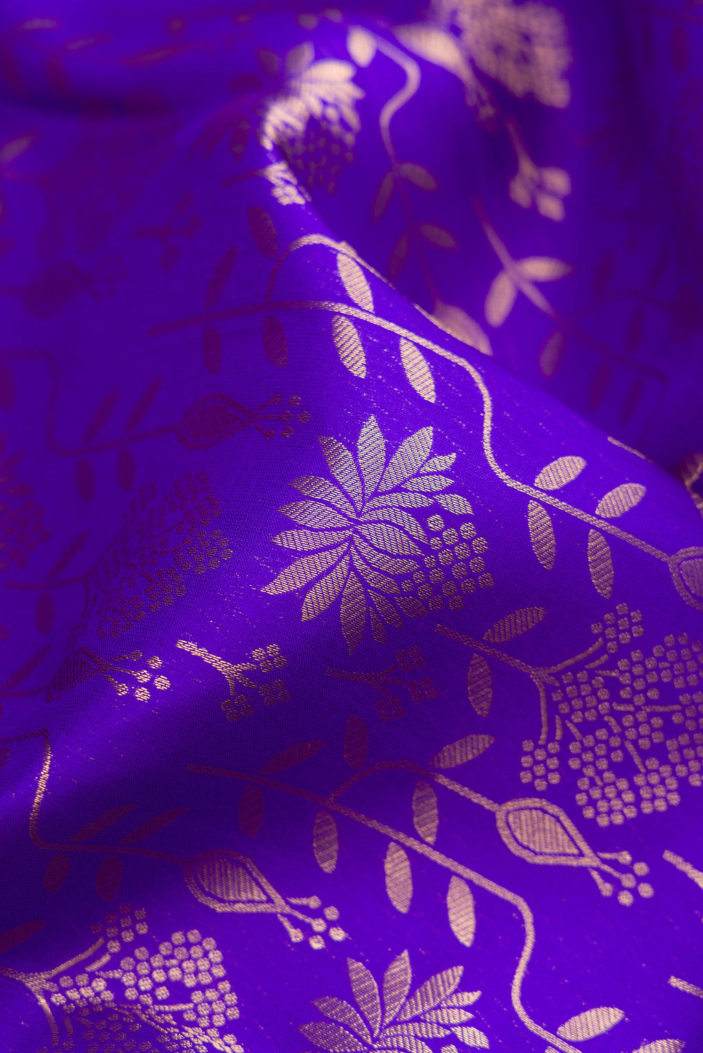 Close up of Royal Blue Kanjivaram Silk Saree with Zari Brocade on the body and Zari Border.  displaying folds