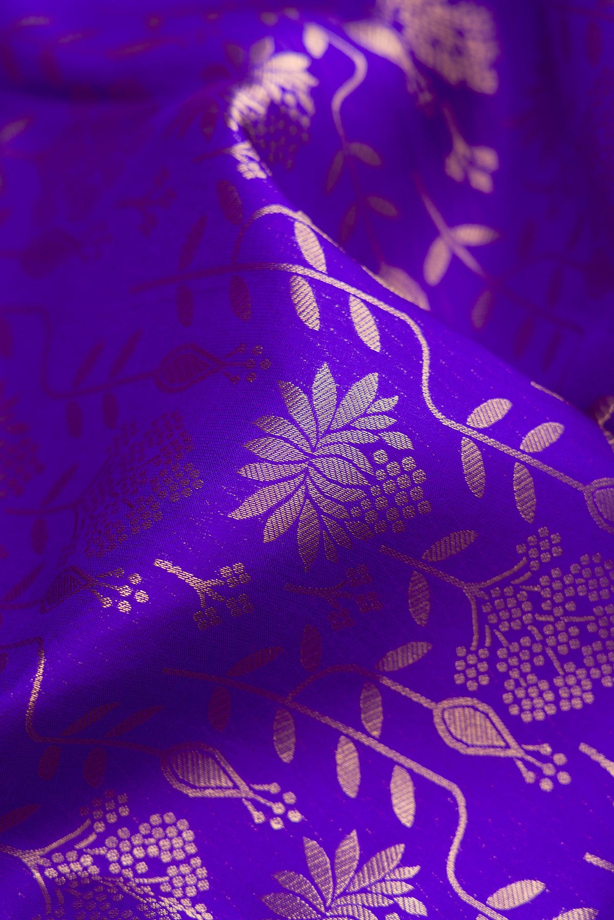 Close up of Royal Blue Kanjivaram Silk Saree with Zari Brocade on the body and Zari Border.  displaying folds