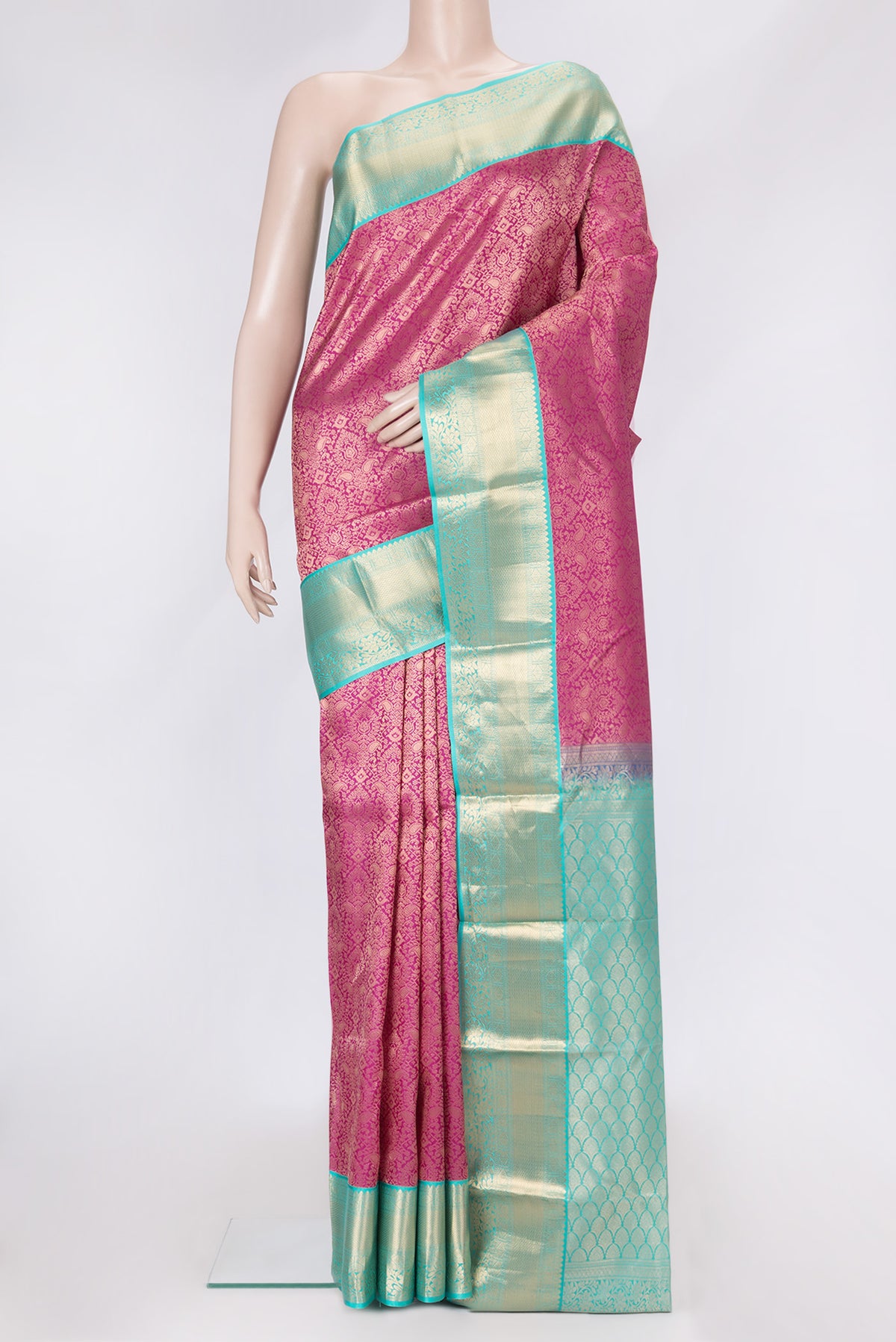 Pink Dual Tone Kanjivaram Silk Saree with Zari Brocade on the body and Zari Border.  displayed on a mannequin