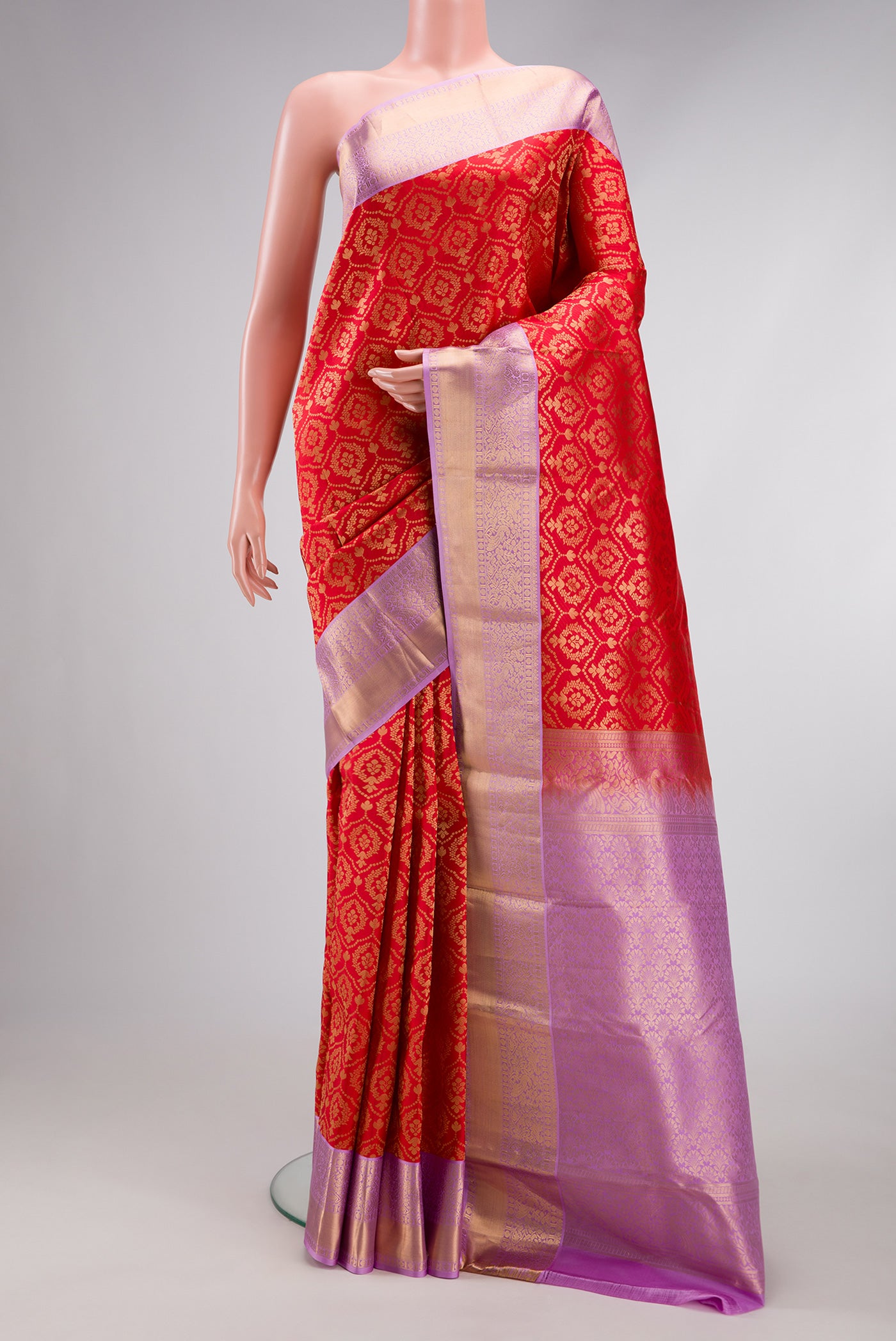 Red Kanjivaram Silk Saree with Zari Brocade on the body and Zari Border.  displayed on a mannequin
