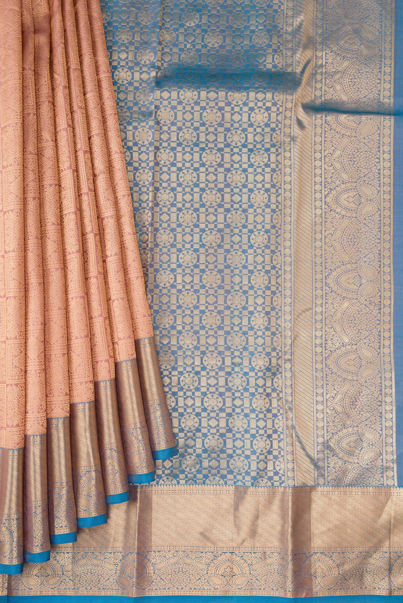 Pleats and pallu of Rose Gold Kanchipuram Silk Saree with Zari Brocade on the body and Zari Border. 