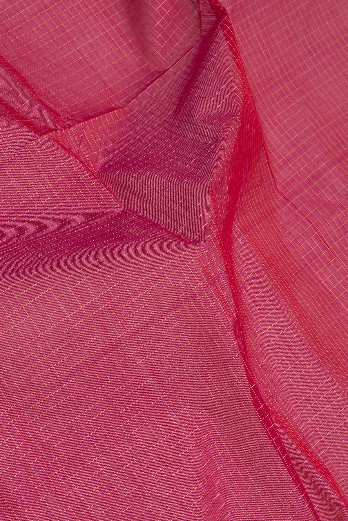 Close up of Red Coimbatore Cotton Saree with Checked design on the body and Thread Border.  displaying folds