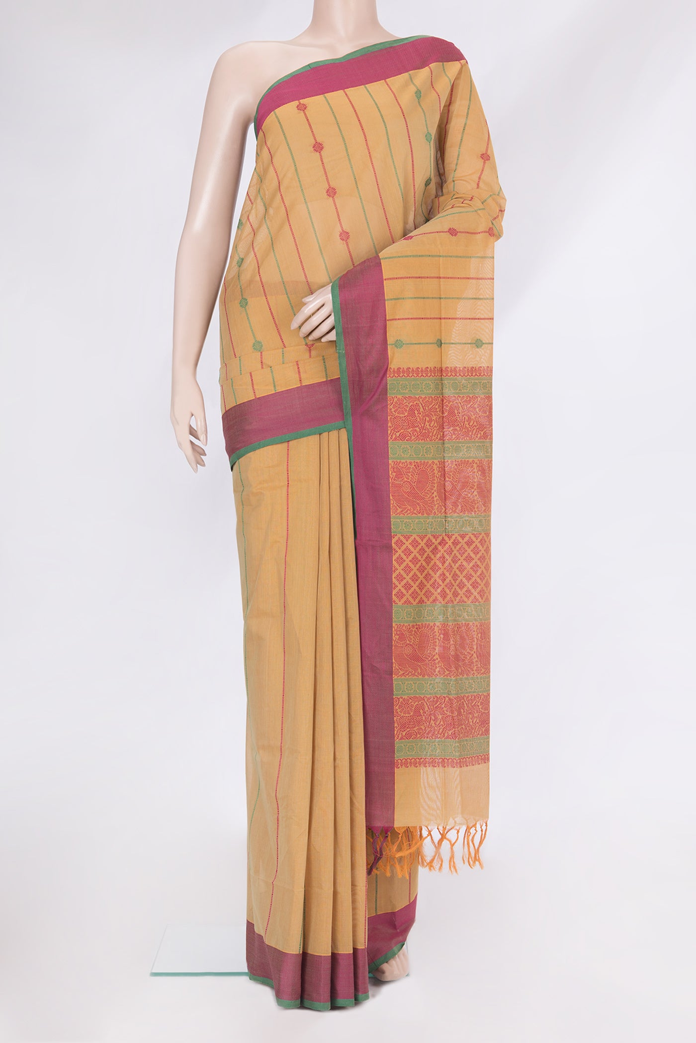 Beige Coimbatore Cotton Saree with Stripes on the body and Thread Border.  displayed on a mannequin