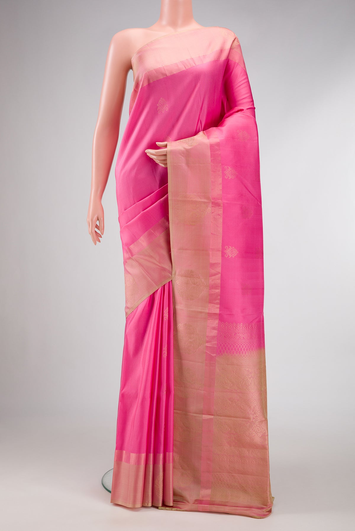 Pink Dual Tone Soft Silk Saree with Zari Butta on the body and Fancy Border.  displayed on a mannequin