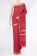 Maroon Kanchipuram Silk Saree with Checked design on the body and Zari Border.  displayed on a mannequin