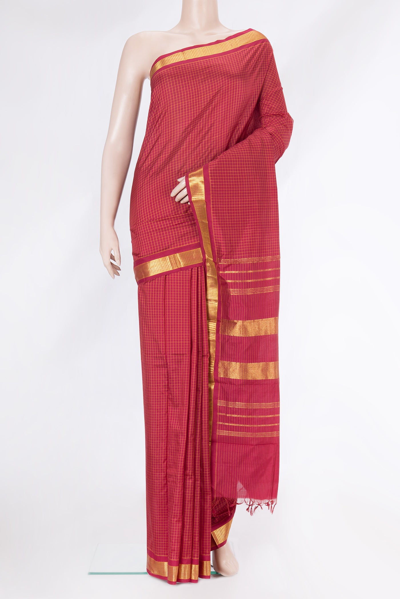 Maroon Kanchipuram Silk Saree with Checked design on the body and Zari Border.  displayed on a mannequin