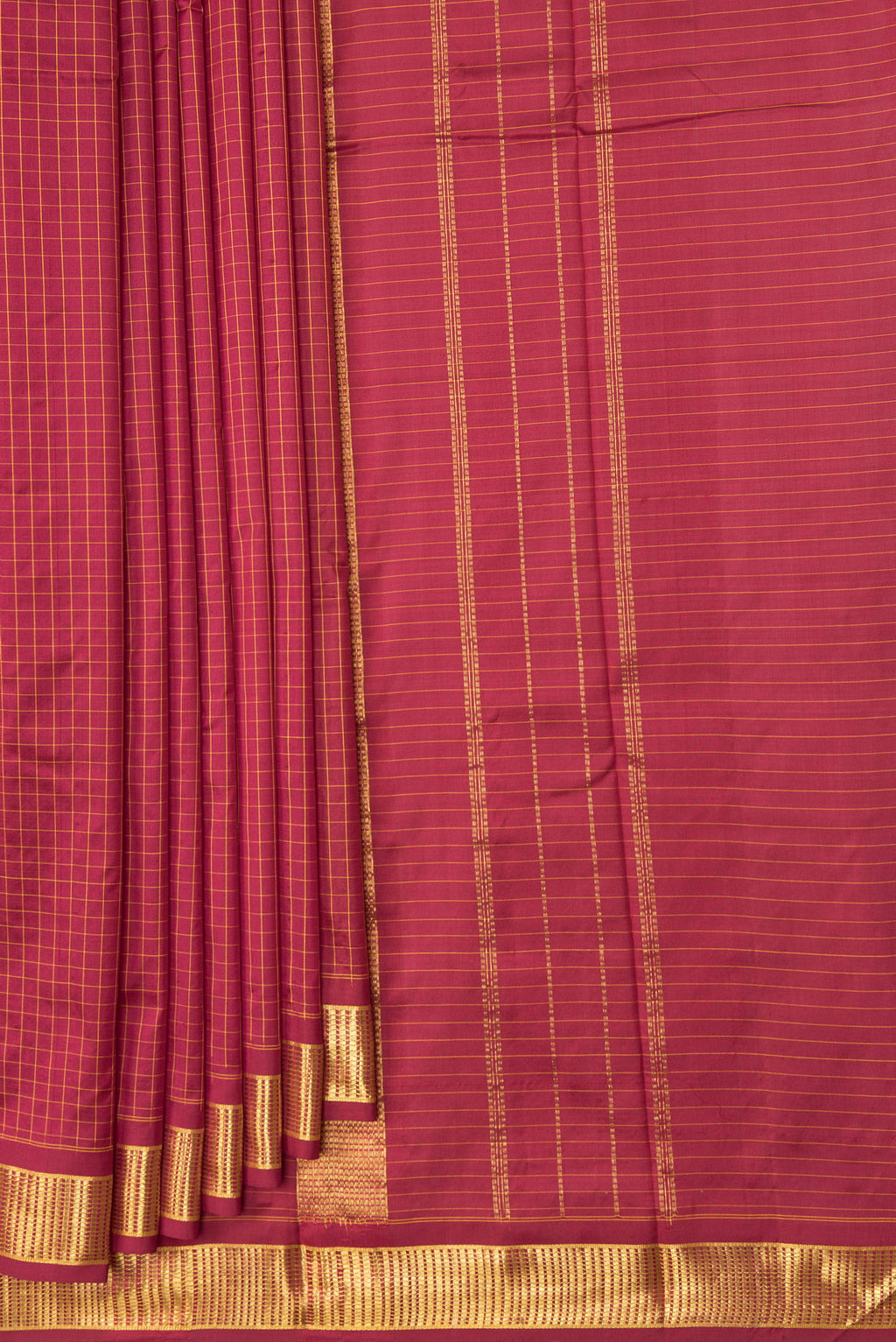 Pleats and pallu of Maroon Kanchipuram Silk Saree with Checked design on the body and Zari Border. 