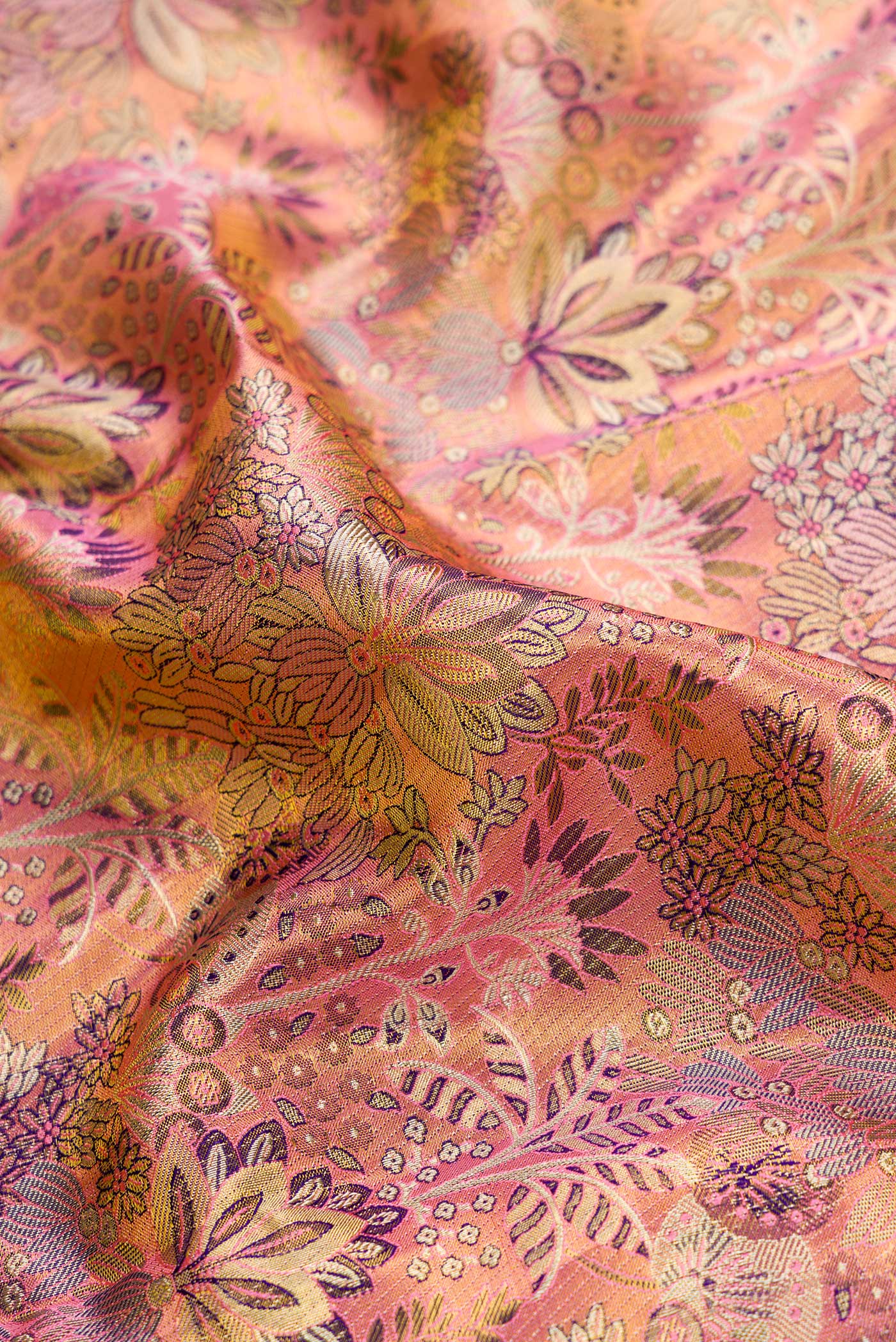 Close up of Pink Dual Tone Kanchipuram Tissue Silk Saree with Zari Brocade on the body and Zari Border.  displaying folds