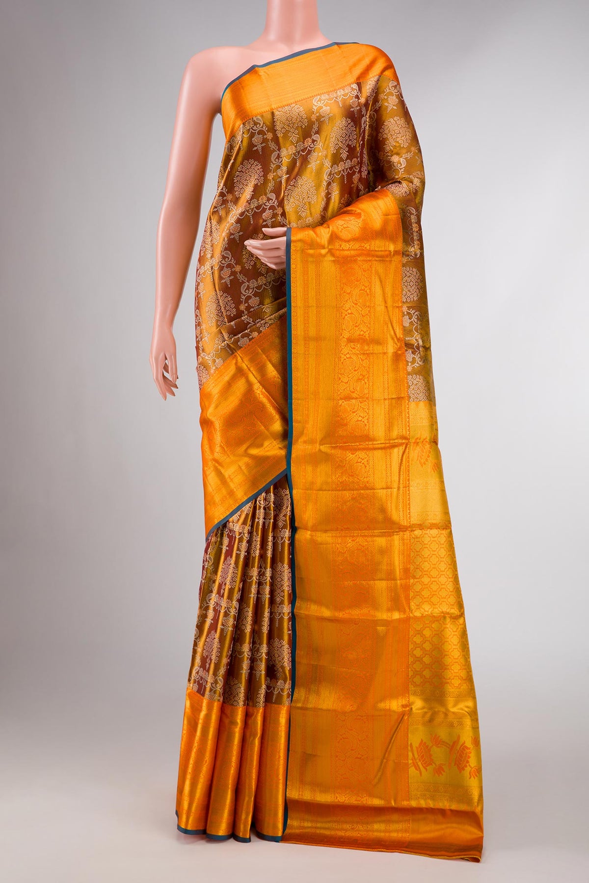 Gold Dual Tone Kanchipuram Tissue Silk Saree with Zari Brocade on the body and Zari Border displayed on a mannequin