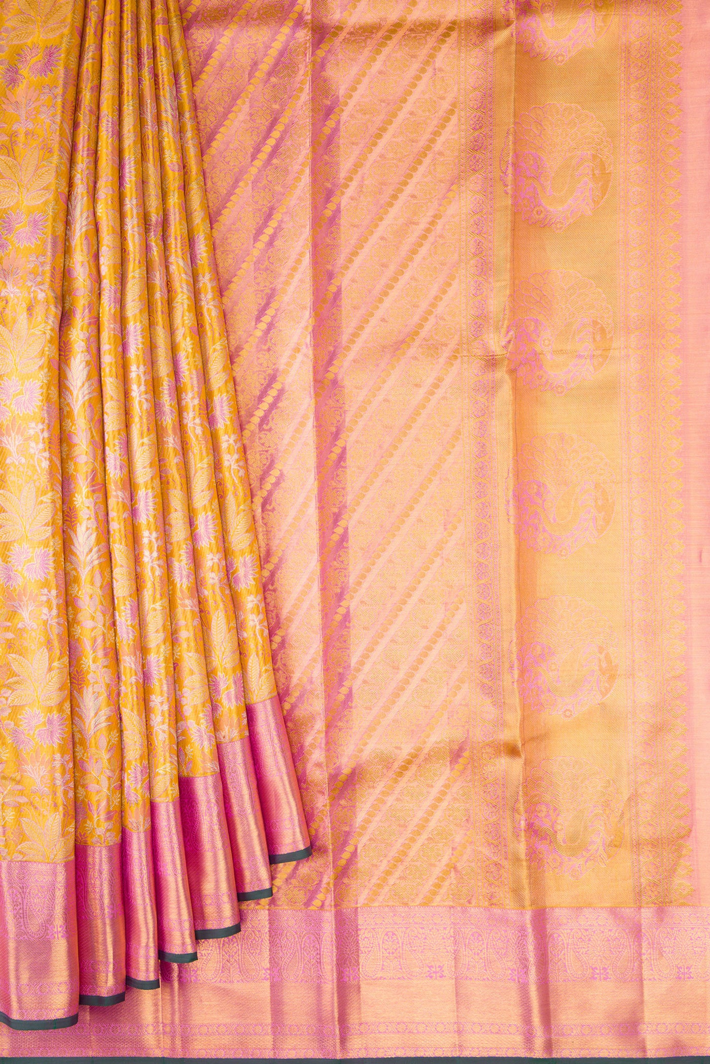 Pleats and pallu of Gold Dual Tone Kanchipuram Tissue Silk Saree with Zari Brocade on the body and Zari Border. 
