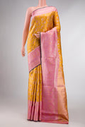 Mustard Dual Tone Kanchipuram Tissue Silk Saree with Zari Brocade on the body and Zari Border displayed on a mannequin