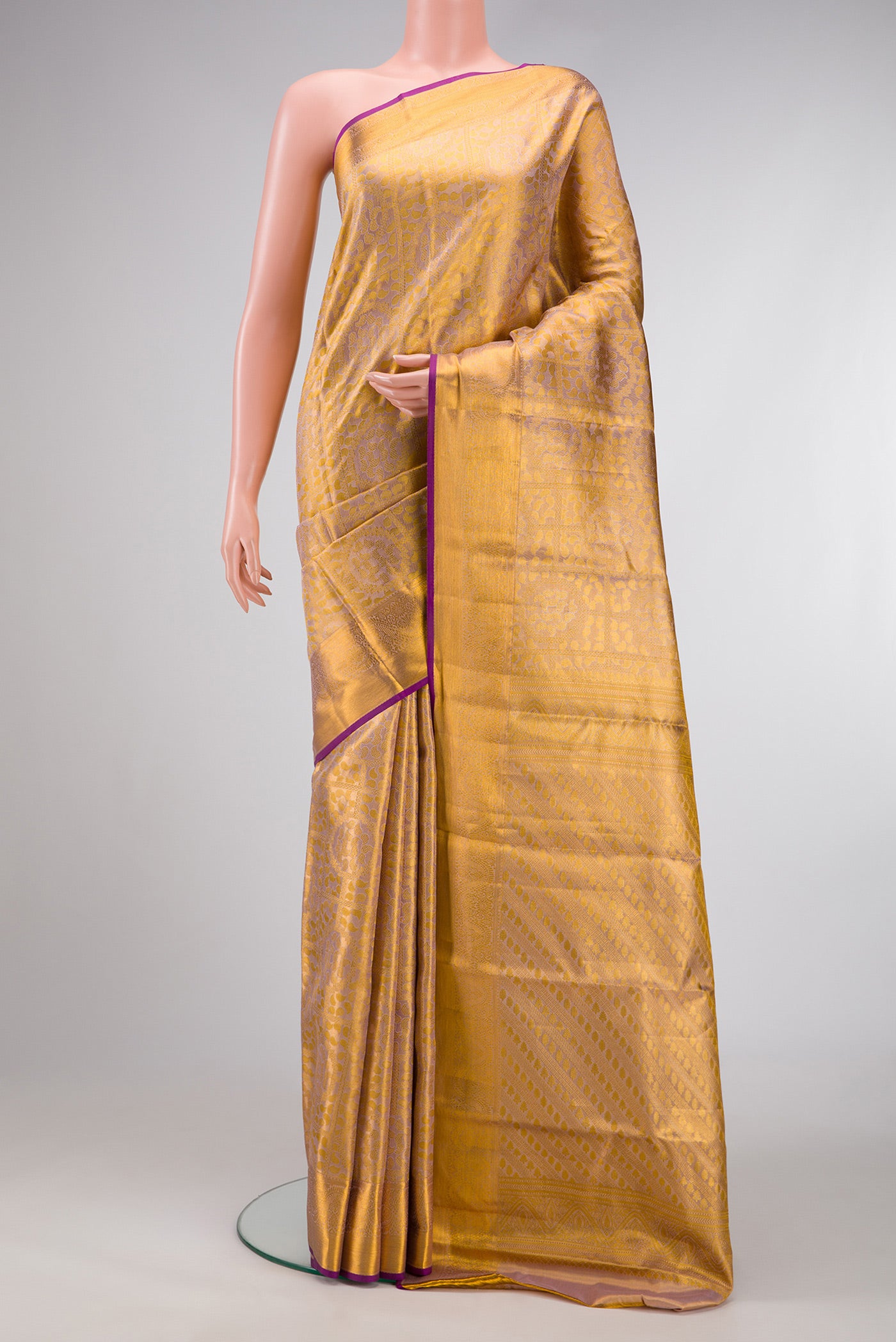 Rose Gold Dual Tone Kanchipuram Tissue Silk Saree with Zari Brocade on the body and Zari Border.  displayed on a mannequin