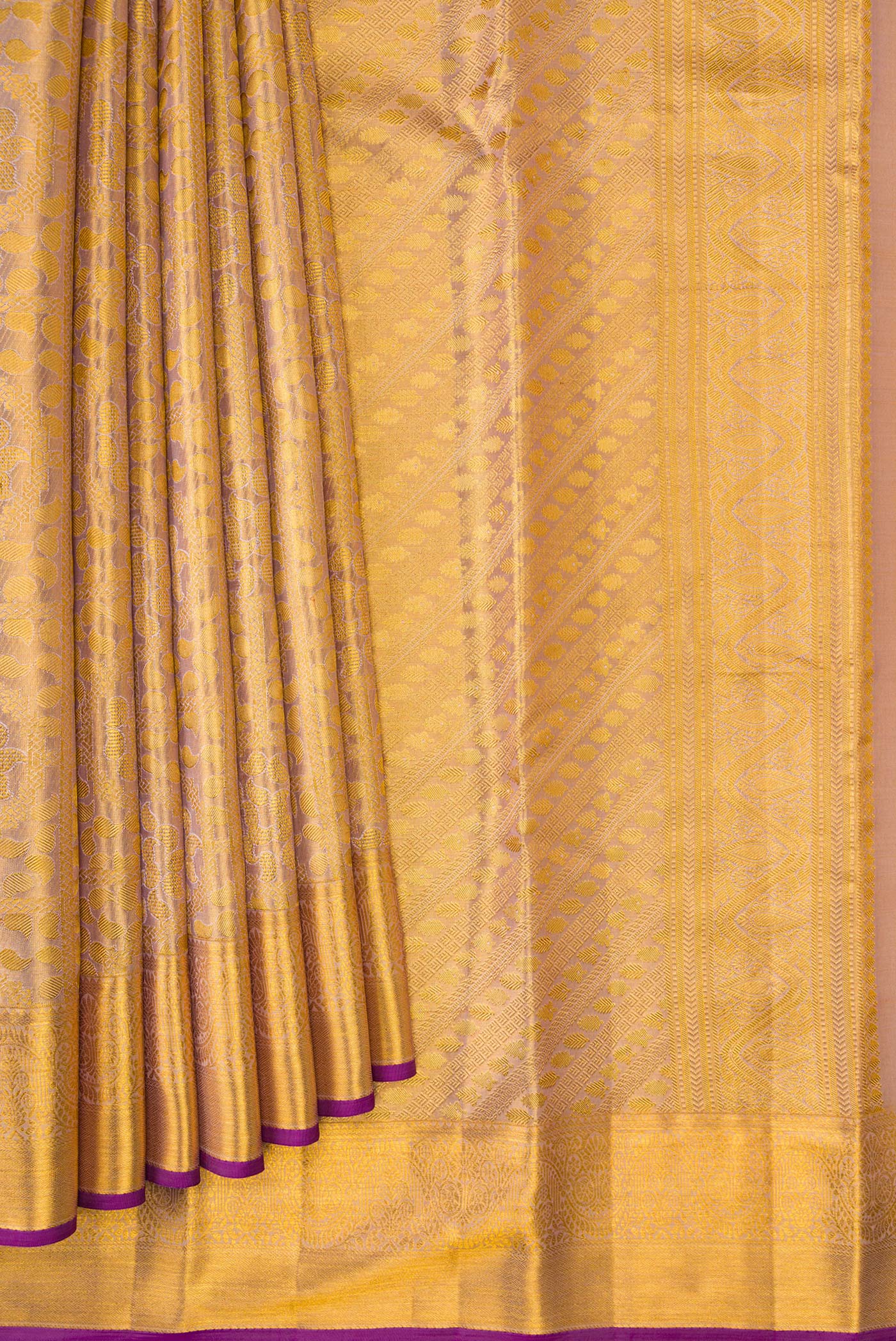 Pleats and pallu of Rose Gold Dual Tone Kanchipuram Tissue Silk Saree with Zari Brocade on the body and Zari Border. 