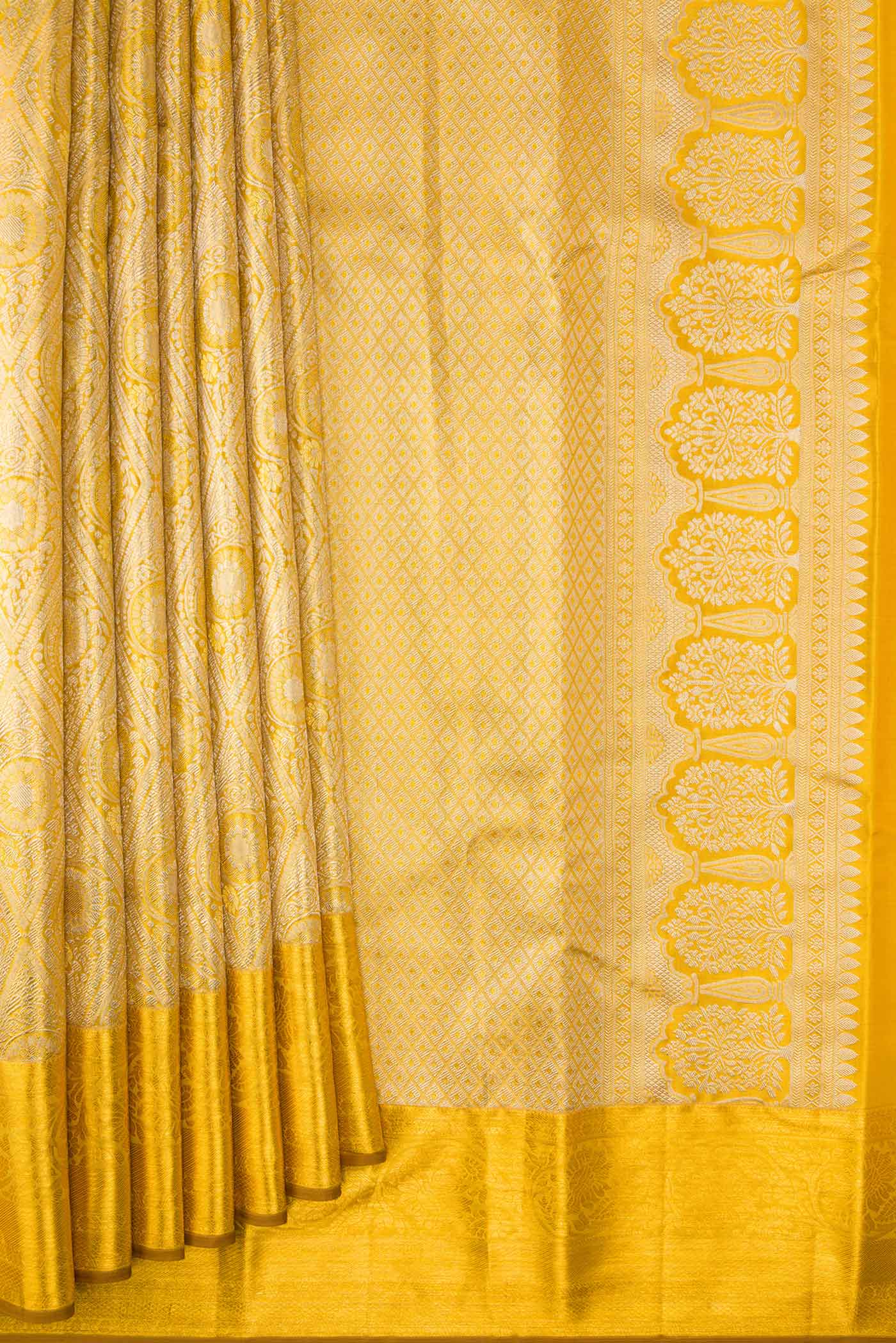 Pleats and pallu of Gold Dual Tone Kanchipuram Tissue Silk Saree with Zari Brocade on the body and Zari Border. 
