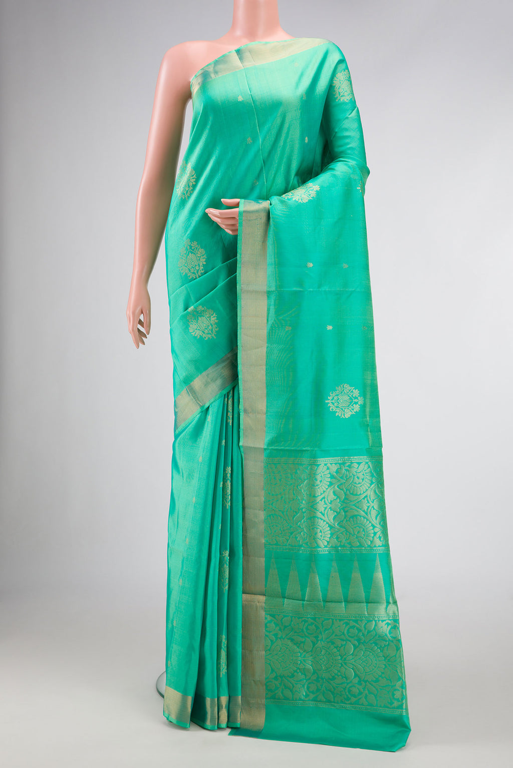 Sea Green Dual Tone Soft Silk Saree with Zari Butta on the body and Zari Border.  displayed on a mannequin