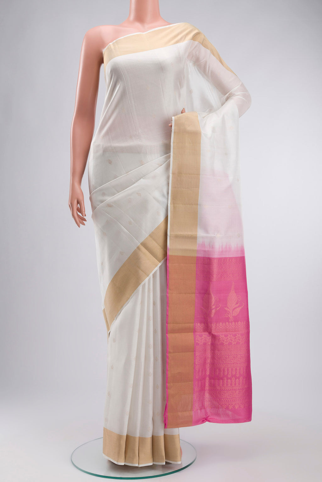 White Soft Silk Saree with Zari Butta on the body and Zari Border displayed on a mannequin