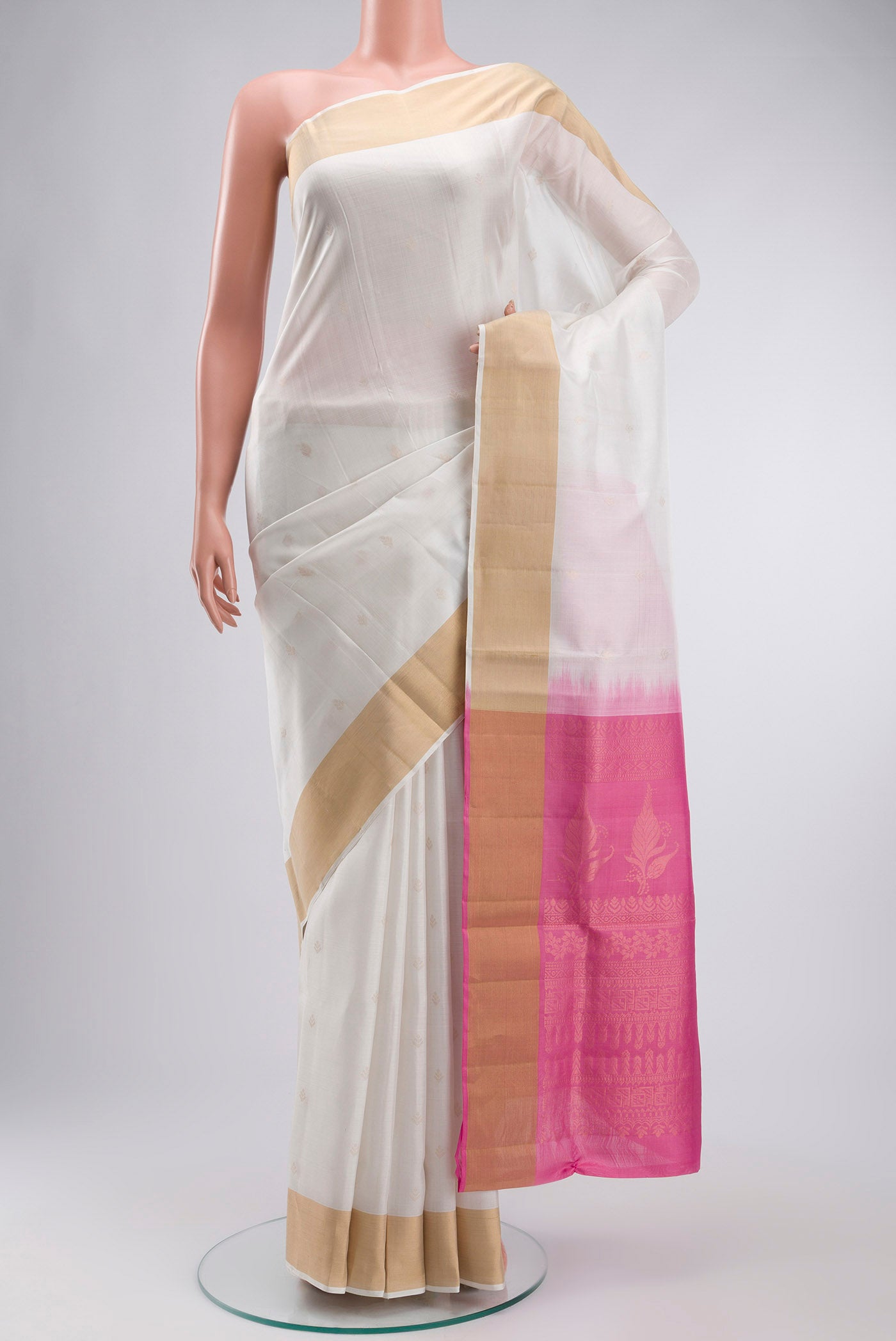 White Soft Silk Saree with Zari Butta on the body and Zari Border displayed on a mannequin