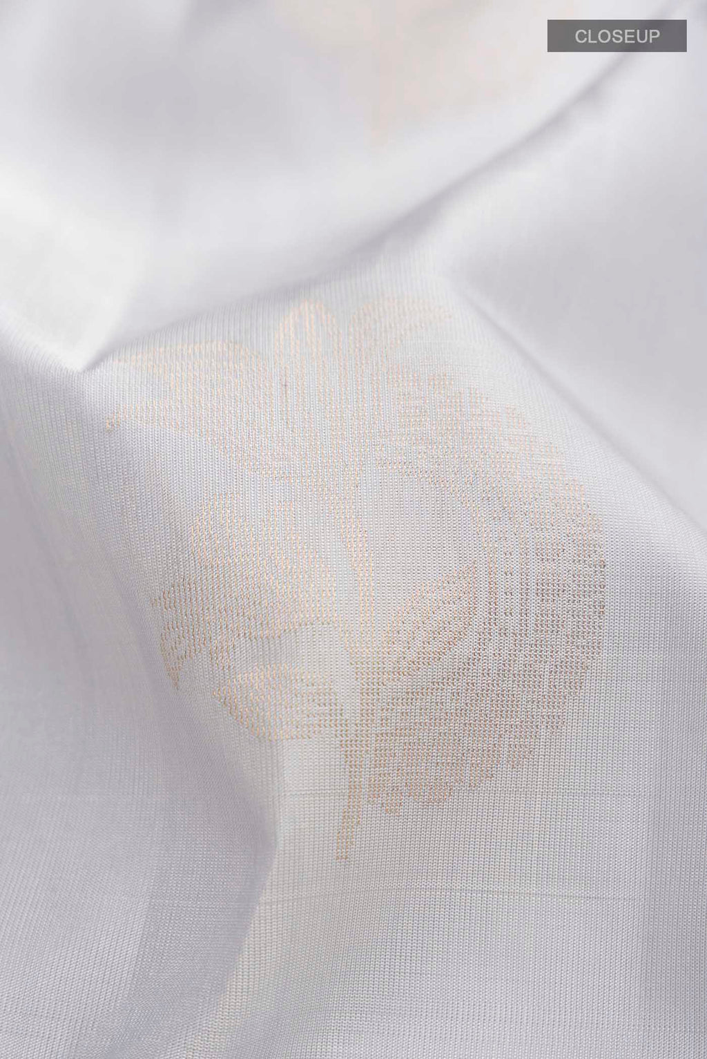 Close up of Light Blue Soft Silk Saree with Zari Butta on the body and Zari Border displaying folds