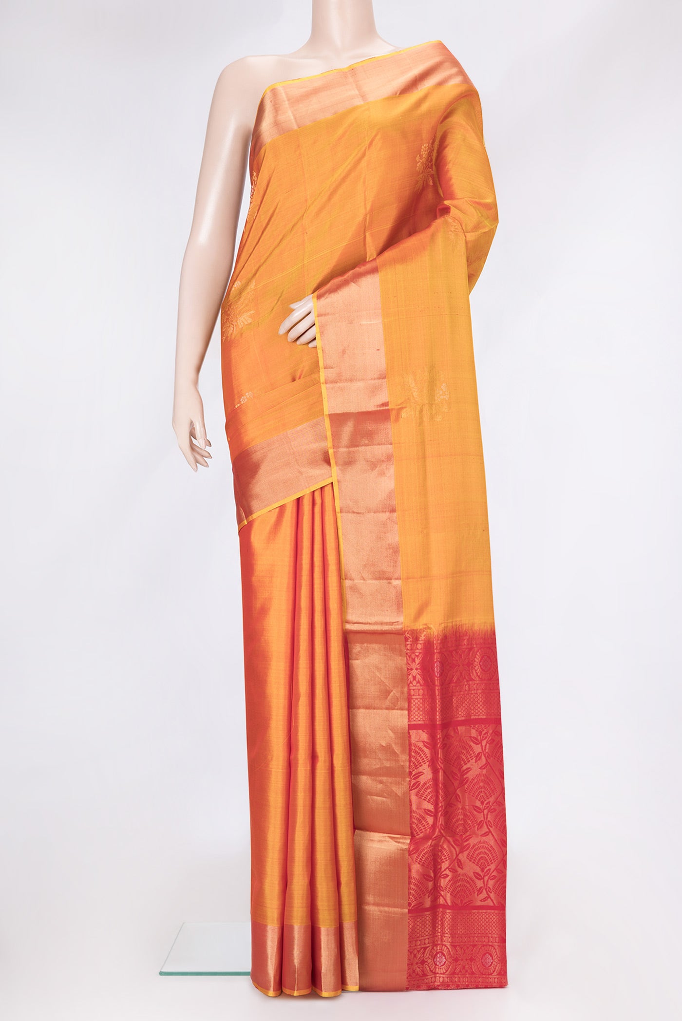 Mustard Dual Tone Soft Silk Saree with Zari Butta on the body and Zari Border.  displayed on a mannequin