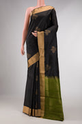 Black Dual Tone Soft Silk Saree with Zari Butta on the body and Zari Border displayed on a mannequin
