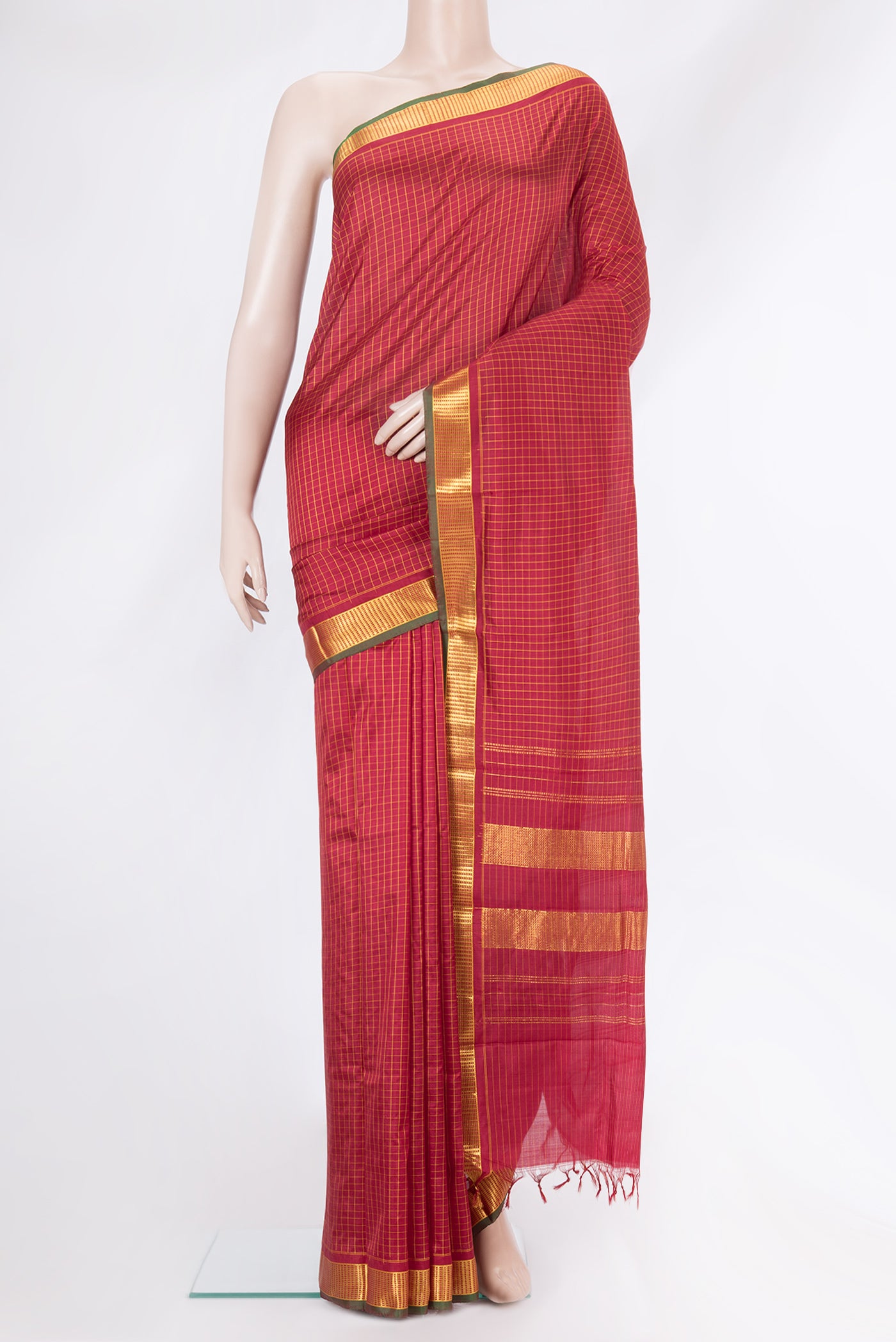 Maroon Kanjivaram Silk Saree with Checked design on the body and Zari Border.  displayed on a mannequin