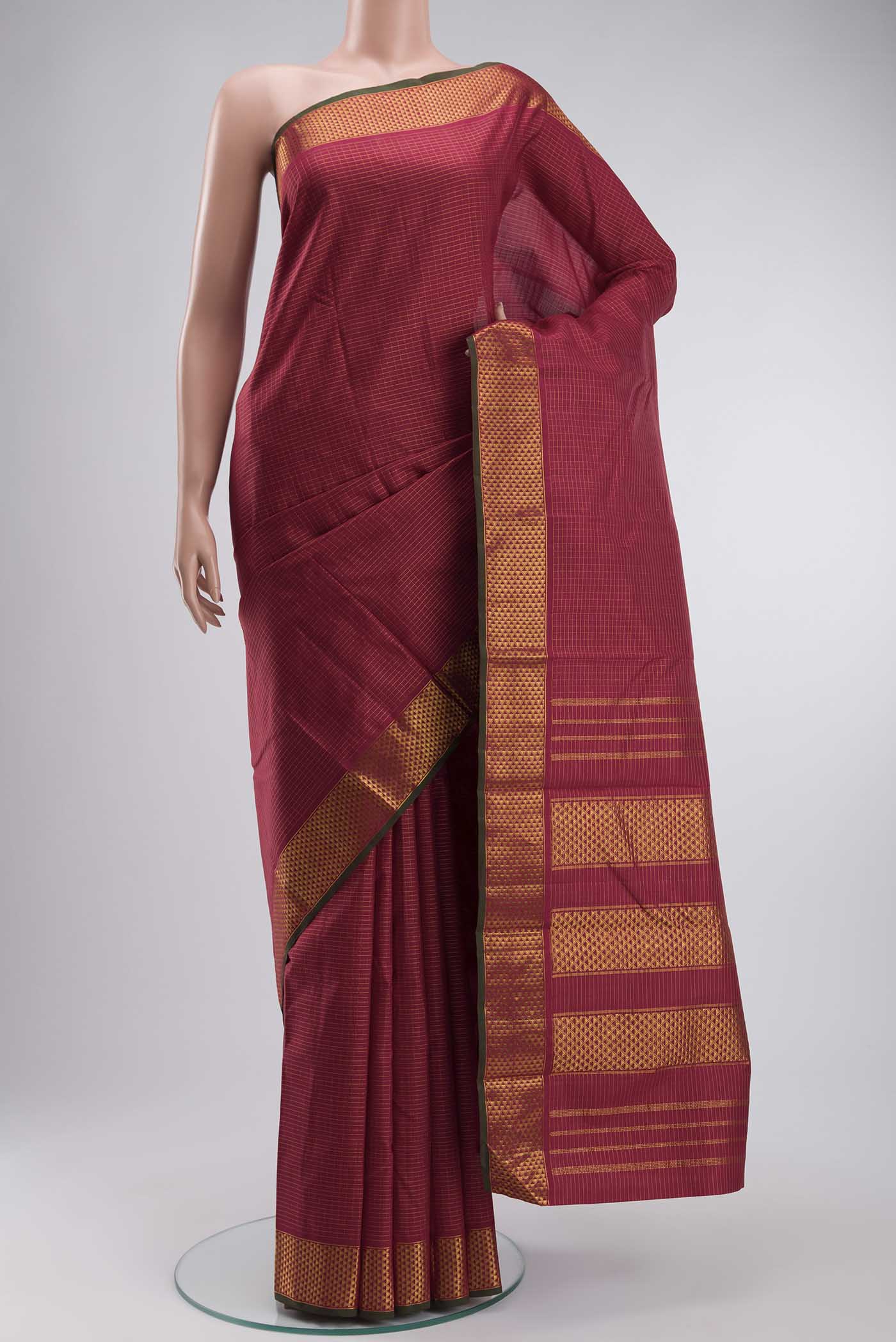 Maroon Kanchipuram Silk Saree with Stripes on the body and Zari Border displayed on a mannequin