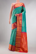Peacock Blue Dual Tone Kanchipuram Silk Saree with Zari Brocade on the body and Zari Border displayed on a mannequin