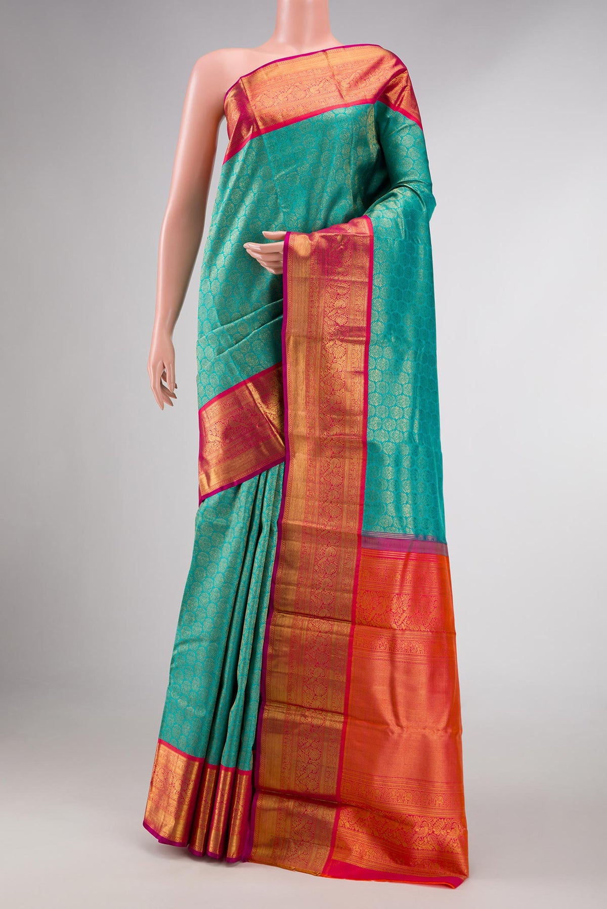 Peacock Blue Dual Tone Kanchipuram Silk Saree with Zari Brocade on the body and Zari Border displayed on a mannequin