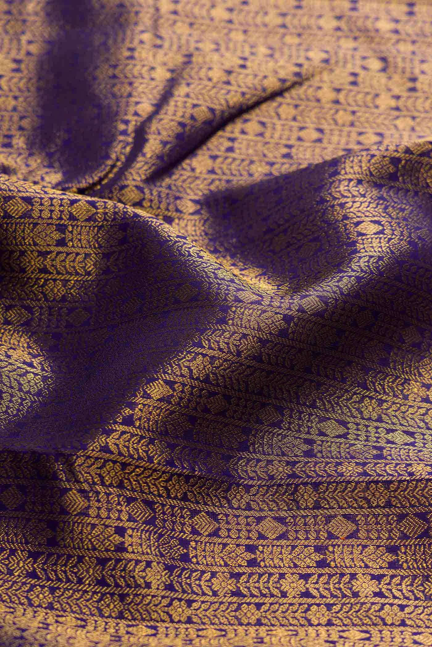 Close up of Navy Blue Dual Tone Kanchipuram Silk Saree with Zari Brocade on the body and Zari Border displaying folds