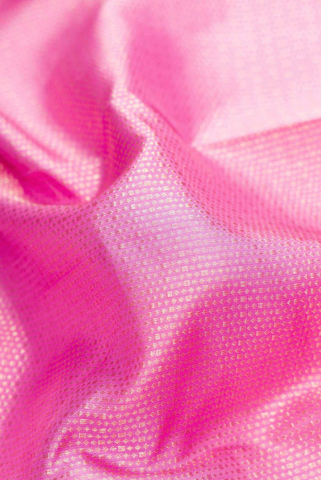 Close up of Pink Dual Tone Kanchipuram Silk Saree with Zari Brocade on the body and Zari Border.  displaying folds