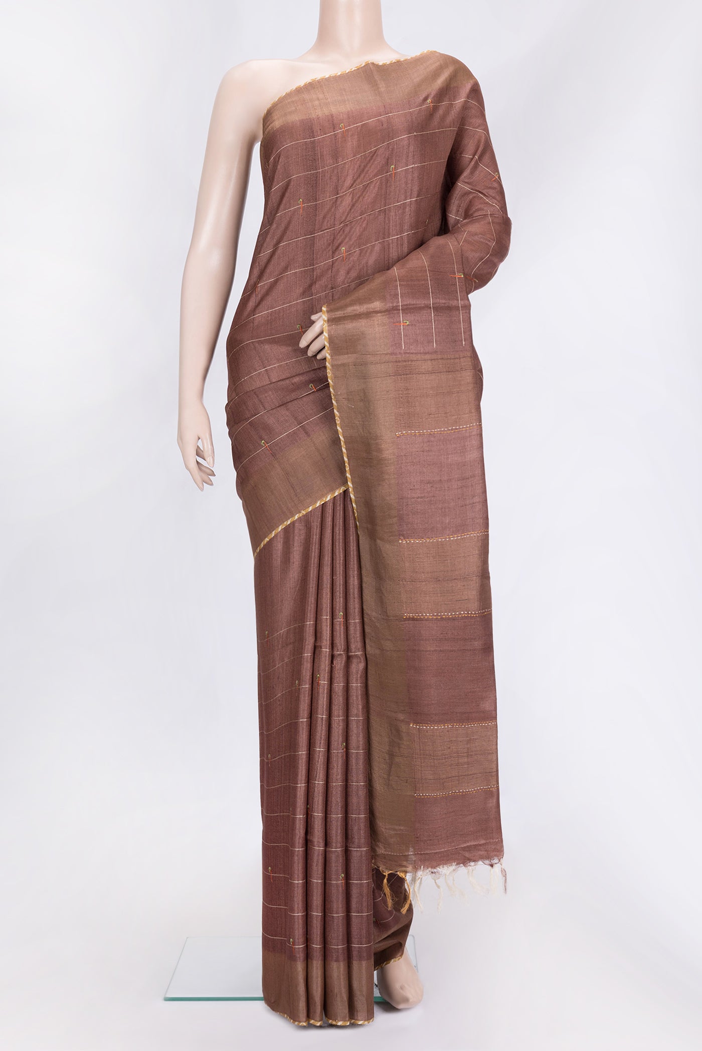 Brown Dual Tone Tussar Silk Saree with Embroidery on the body and Plain Border.  displayed on a mannequin